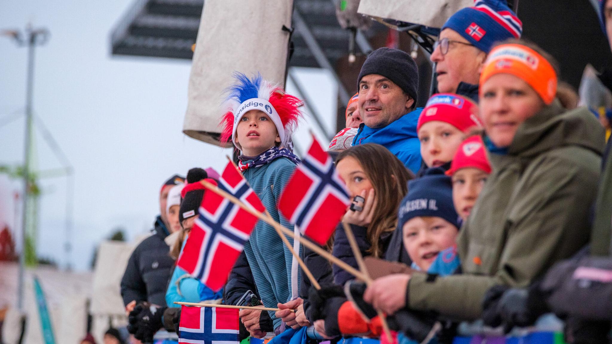 People watching skiing from the stands.