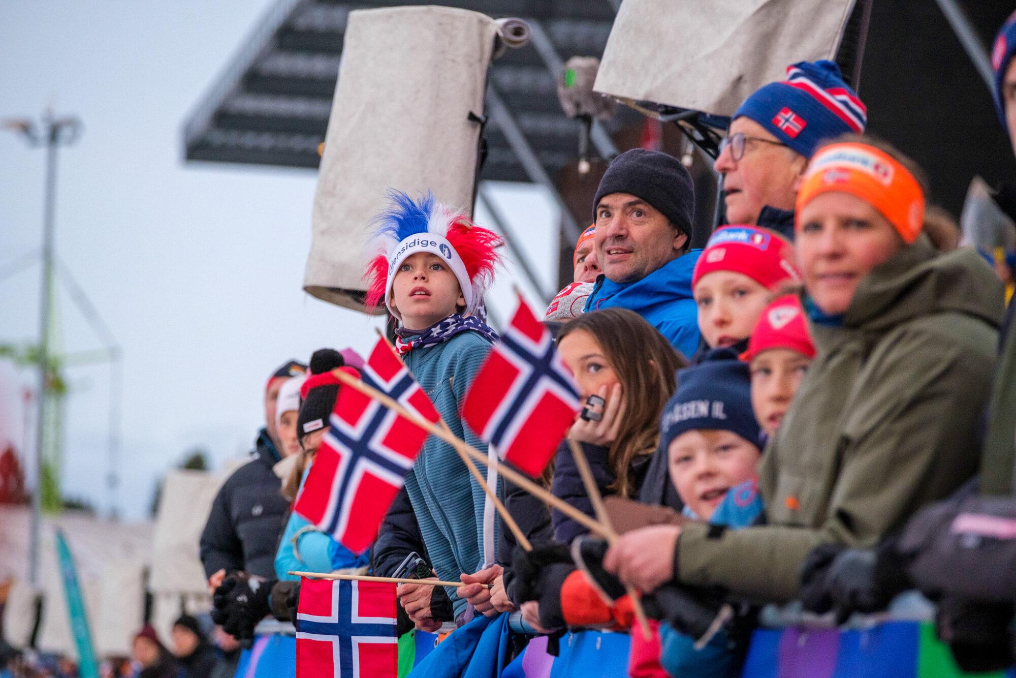 People watching skiing from the stands.