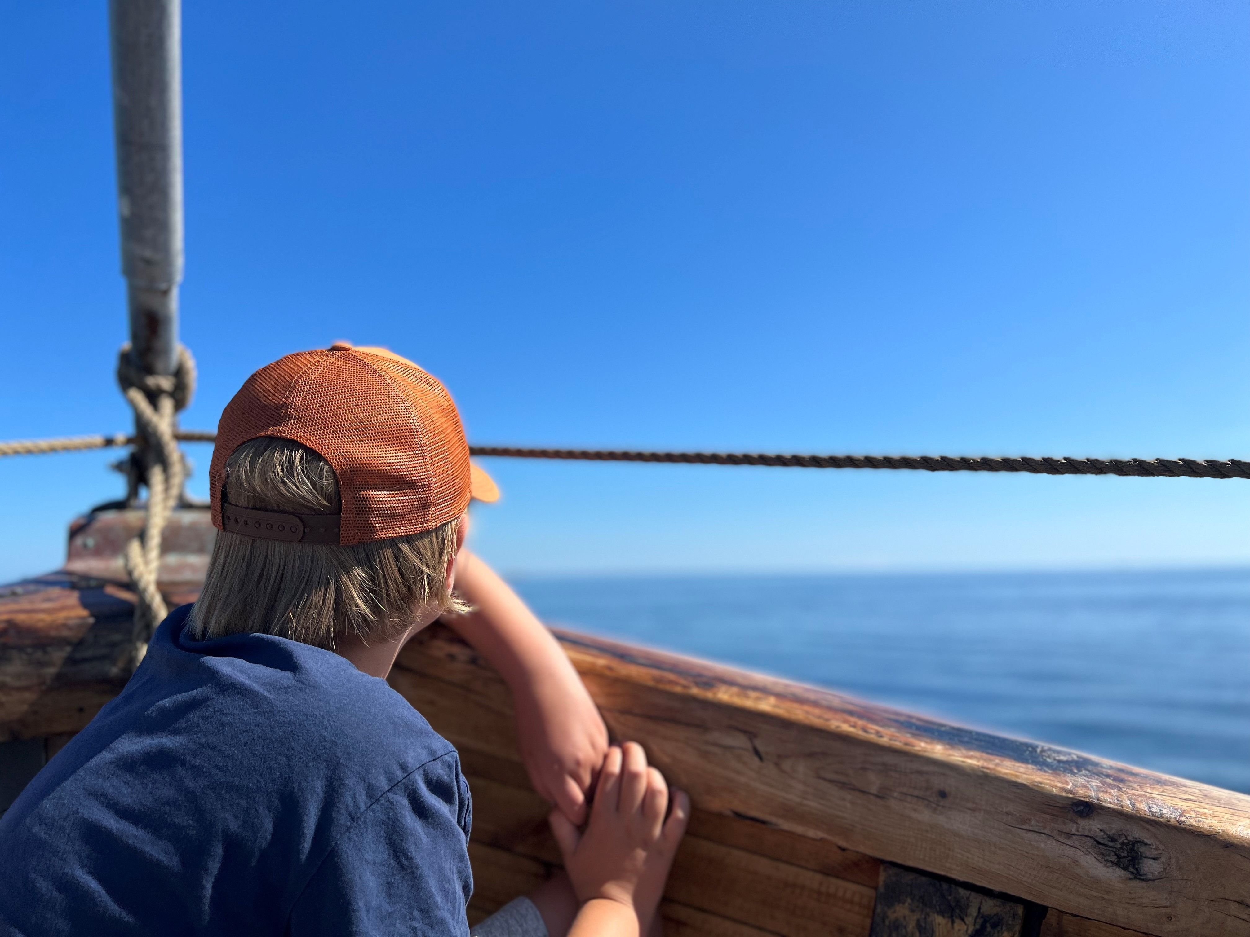 A young boy touring with Badebåden boat outside of Grimstad, Southern Norway.