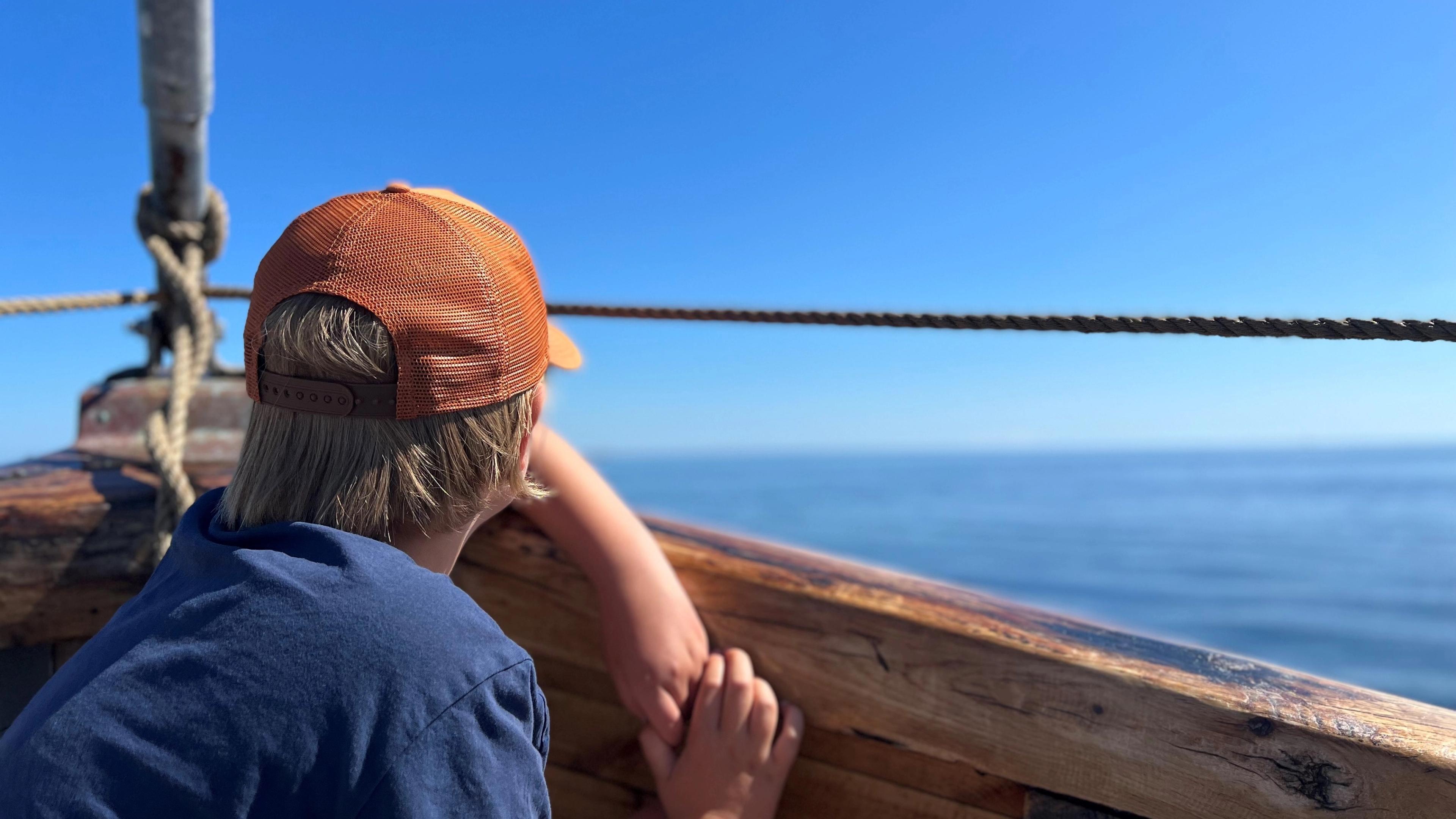 A young boy touring with Badebåden boat outside of Grimstad, Southern Norway.