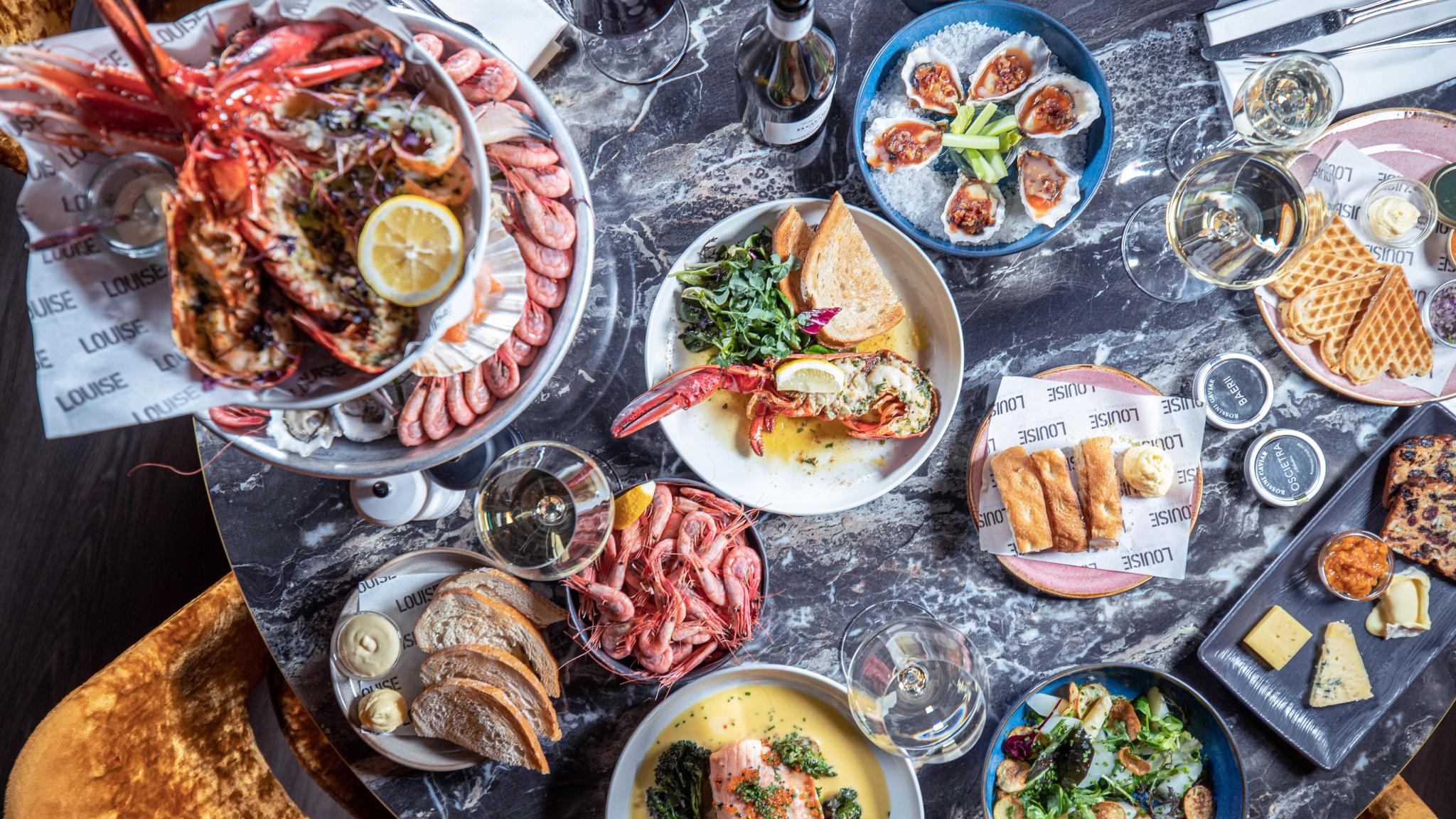 Shrimps, lobsters and seafood dishes on a table