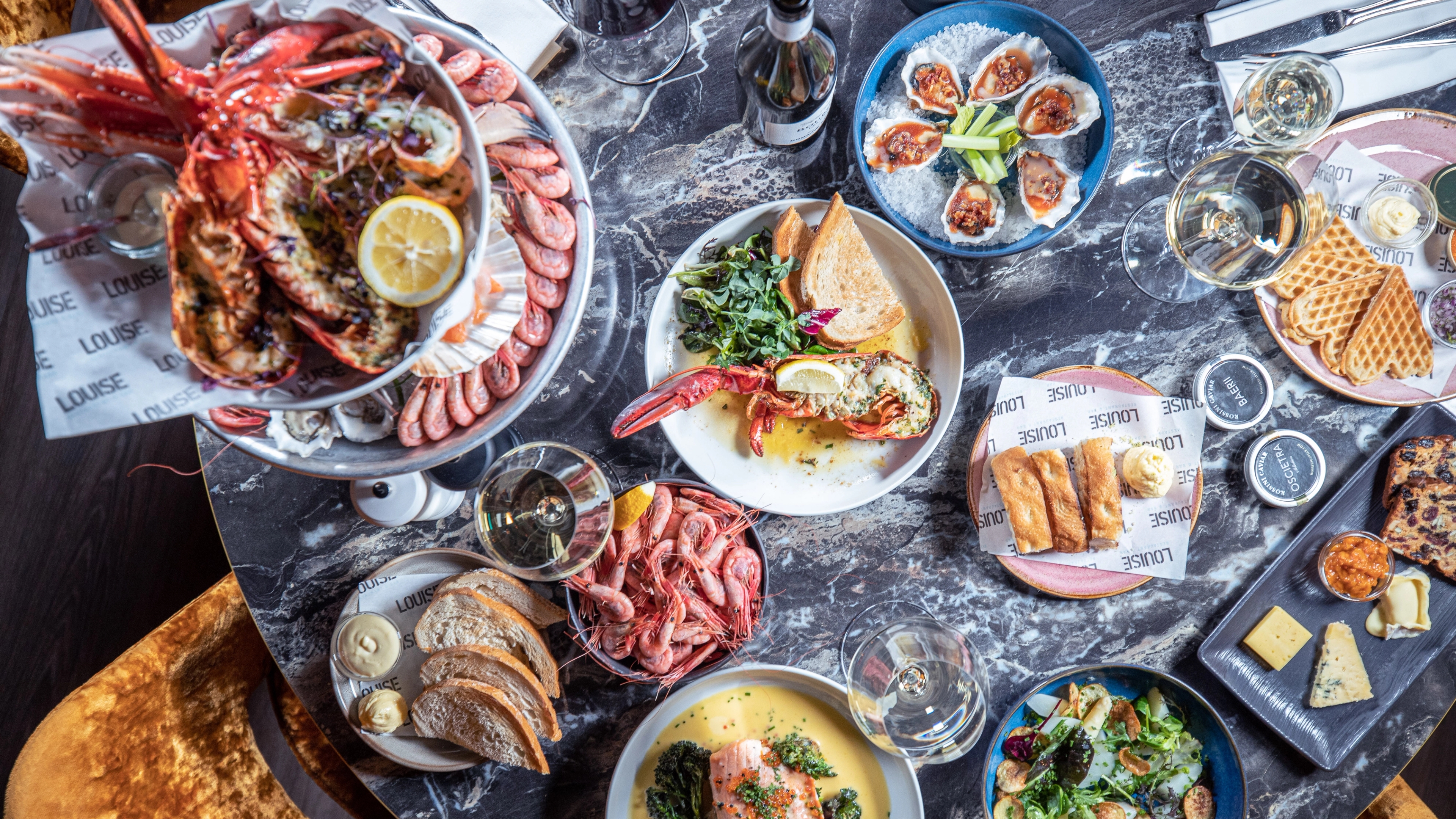 Shrimps, lobsters and seafood dishes on a table