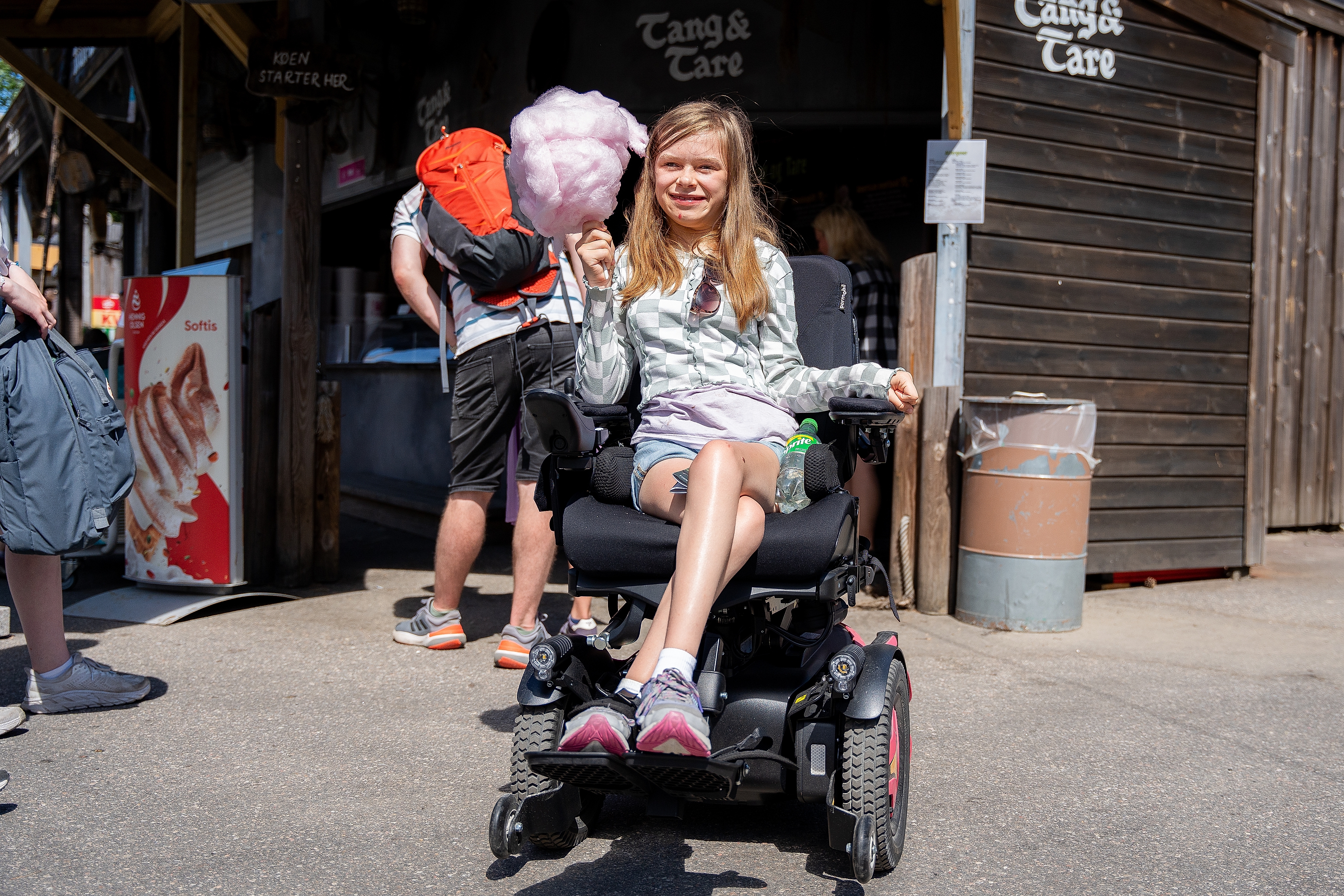 A girl holding a cotton candy in Dyreparken Zoo in Kristiansand, Southern Norway