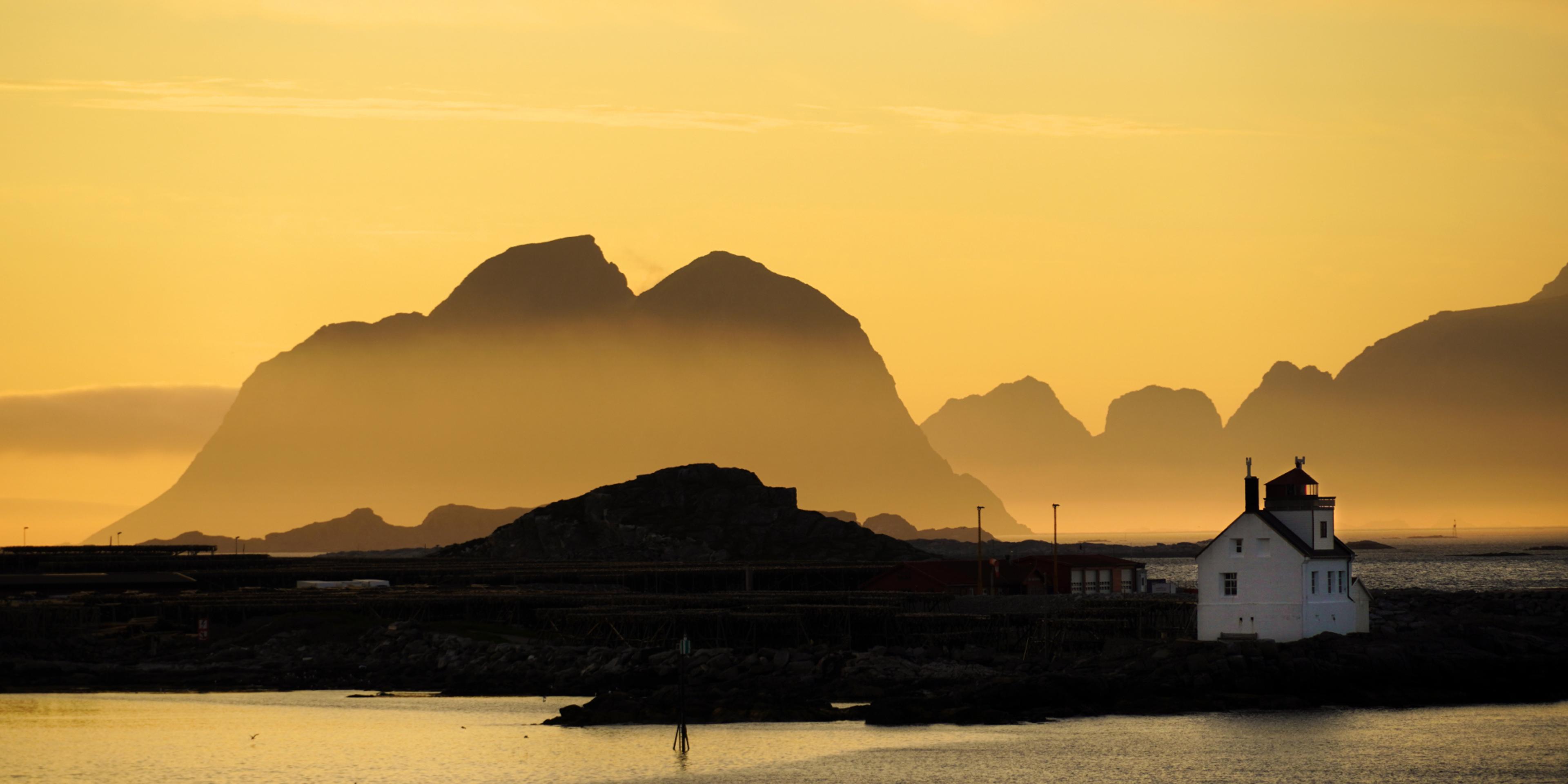 Lighthouse in the midnight sun at Værøy, Lofoten