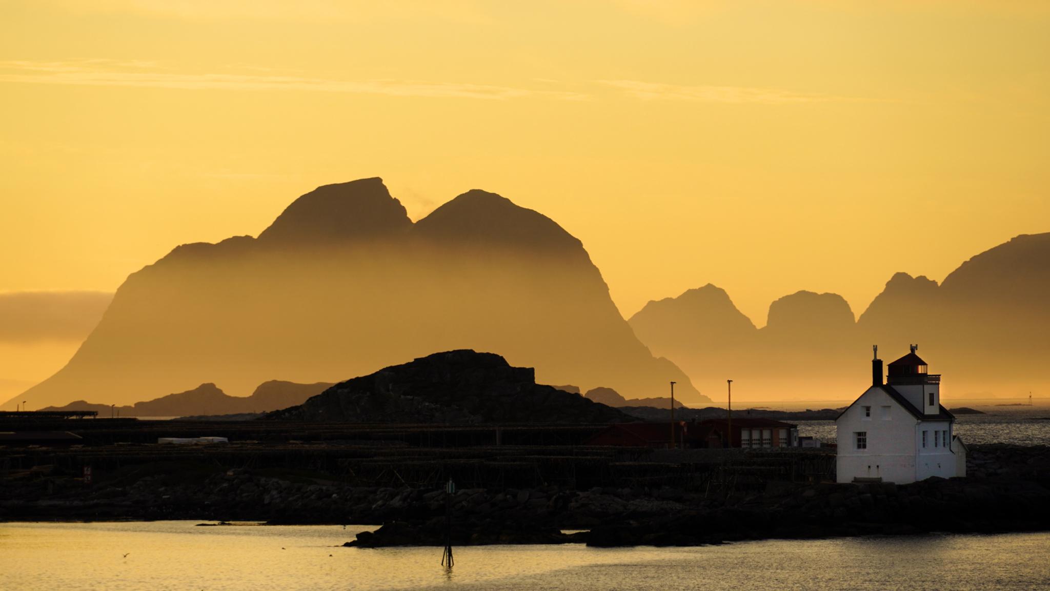 Lighthouse in the midnight sun at Værøy, Lofoten