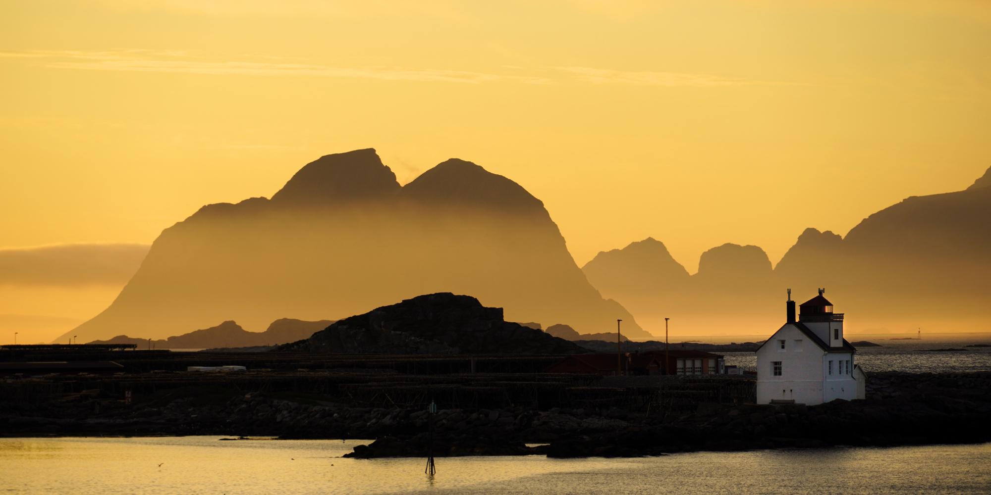 Lighthouse in the midnight sun at Værøy, Lofoten