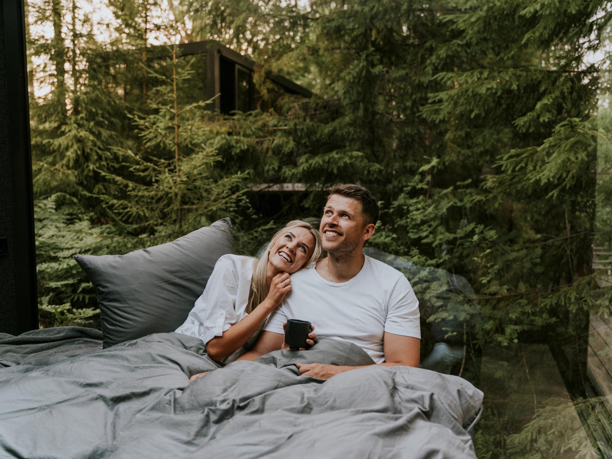 A man and a woman in bed at Laagen in Vestfold in Eastern Norway