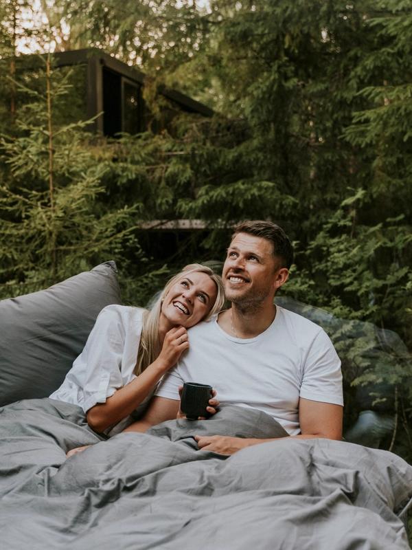 A man and a woman in bed at Laagen in Vestfold in Eastern Norway
