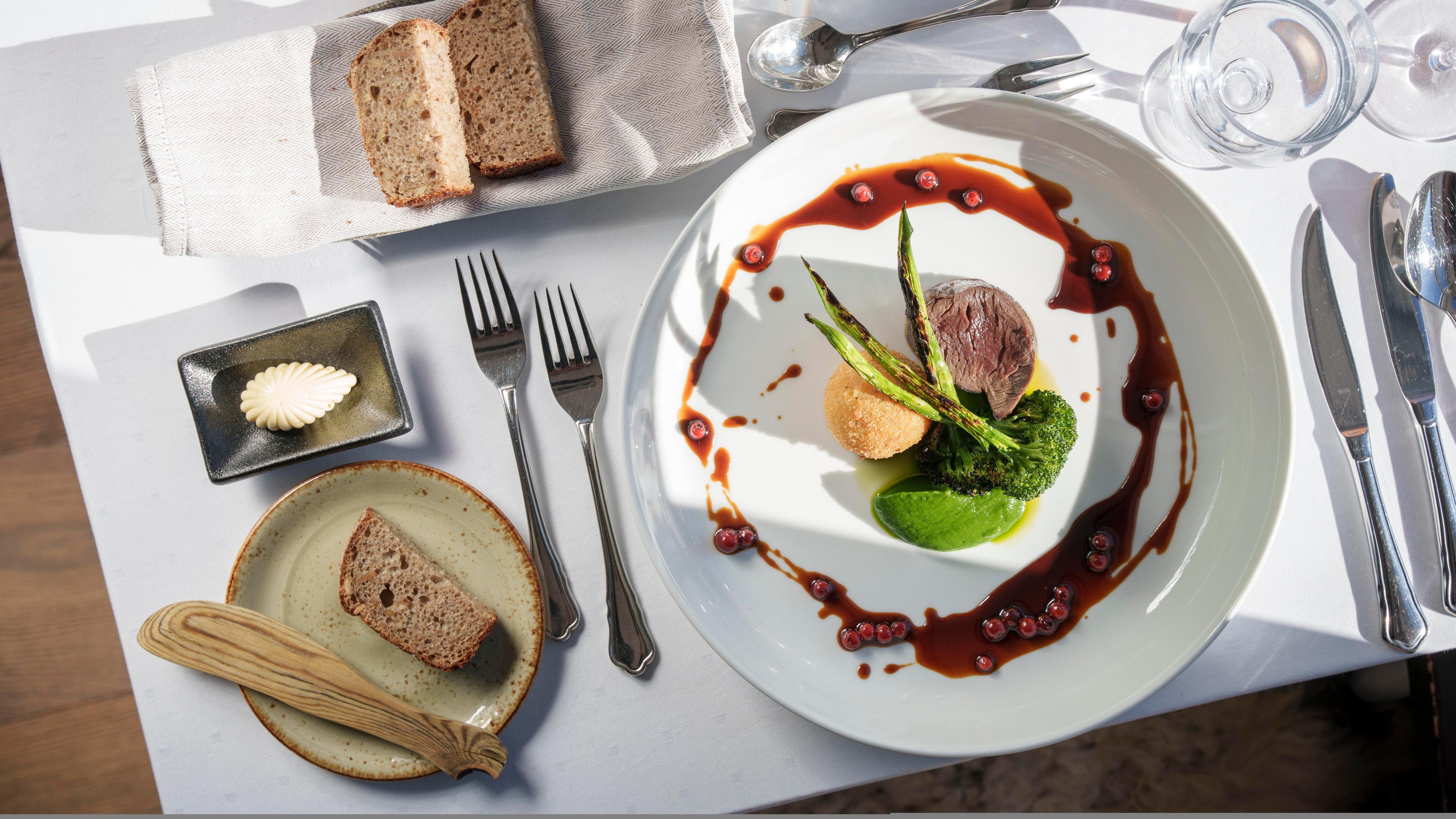Food at a plate on a table in the restaurant at Skåbu mountain hotel, Skåbu, Norway.
