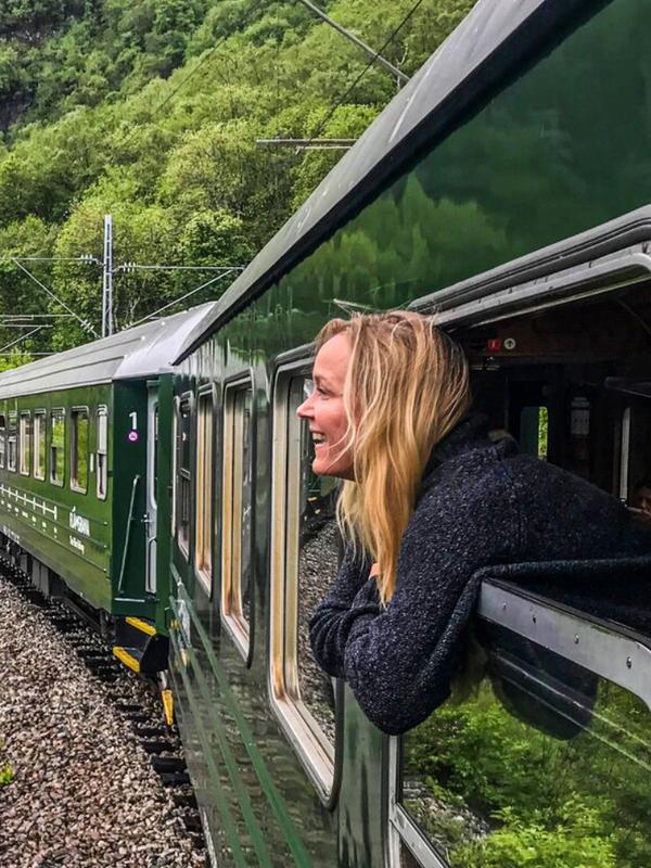 A woman traveling with Flåm railway