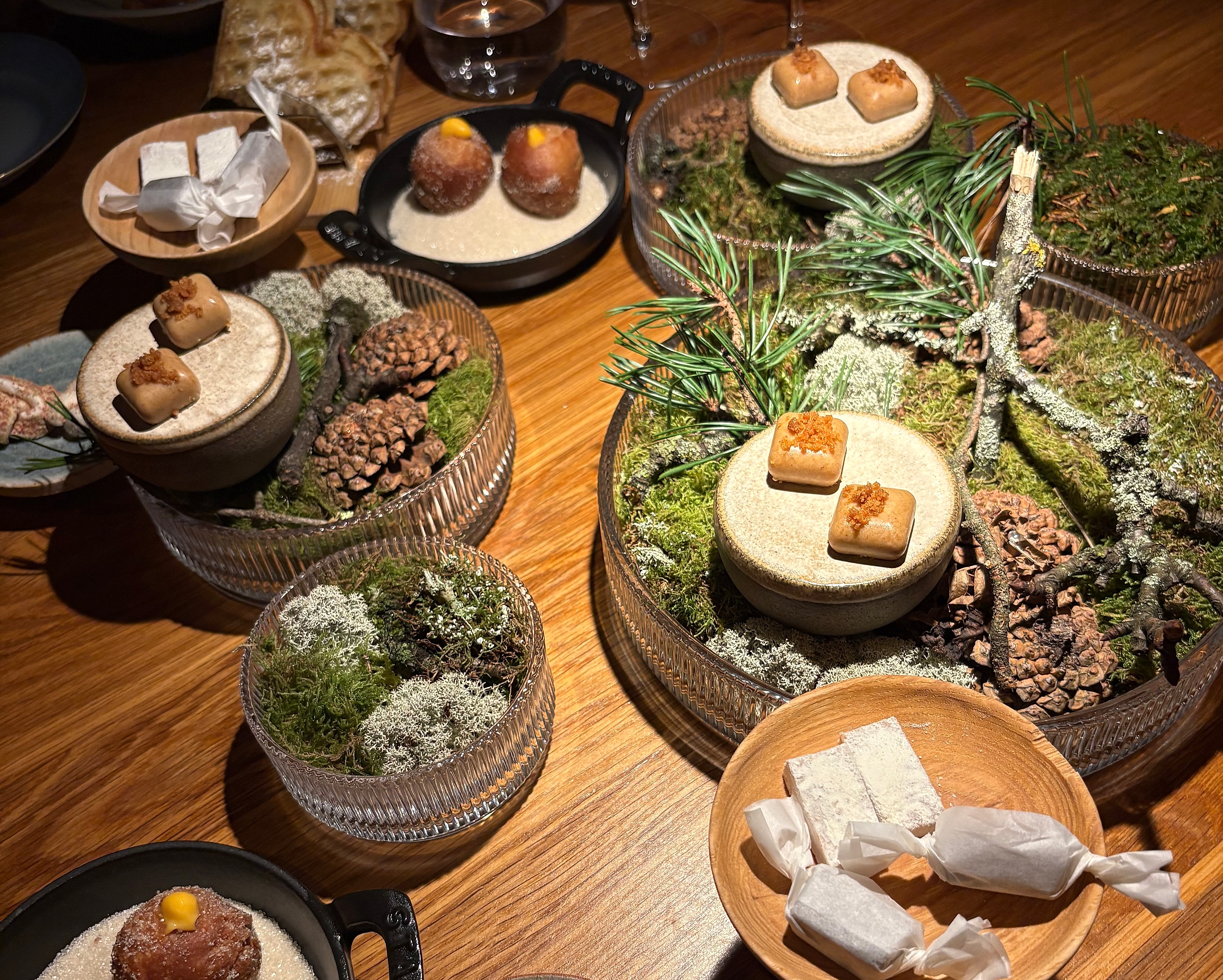 A lot of small plates on a table at Credo restaurant in Oslo.