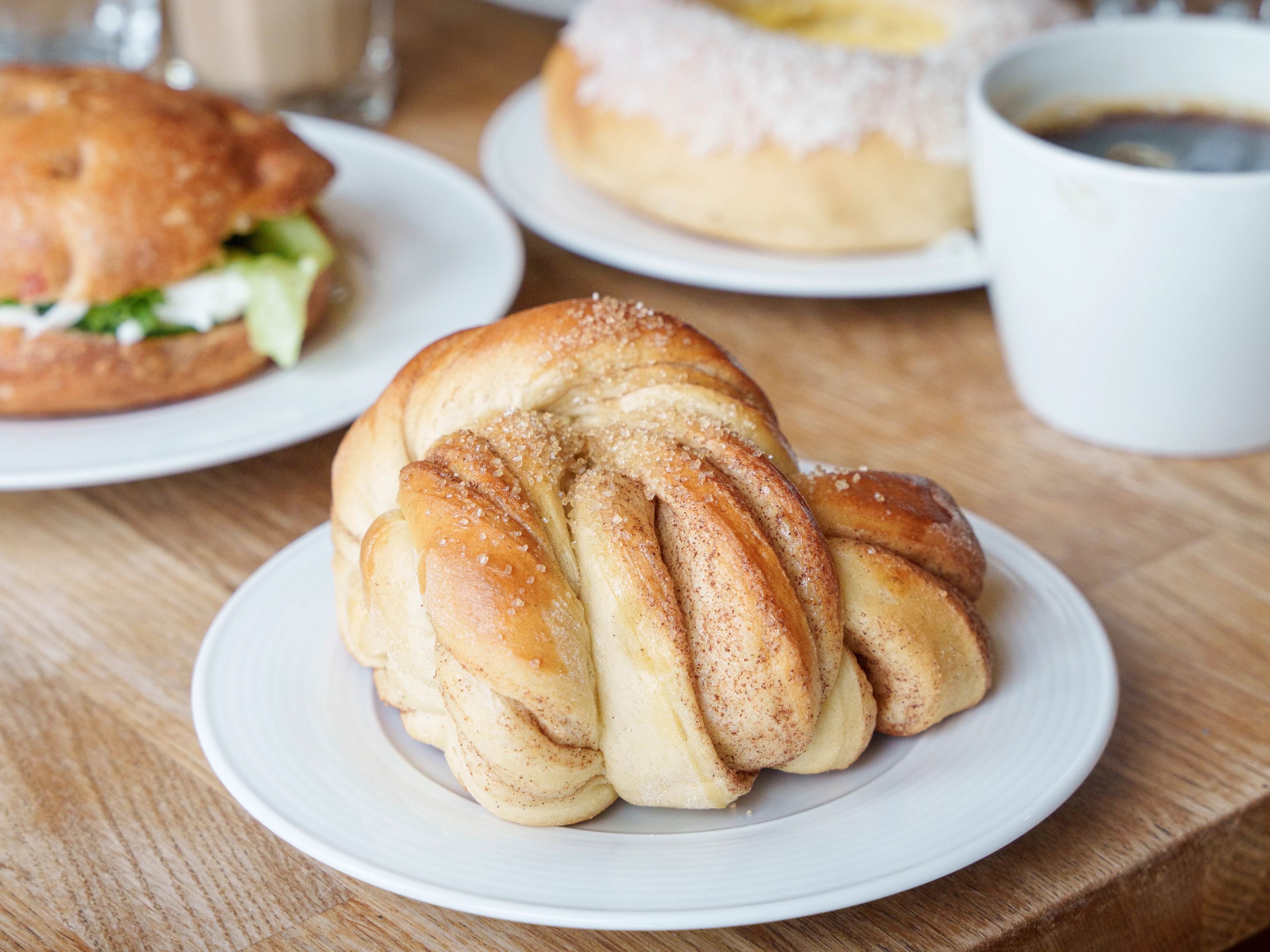 A cinnamon bun on a plate.