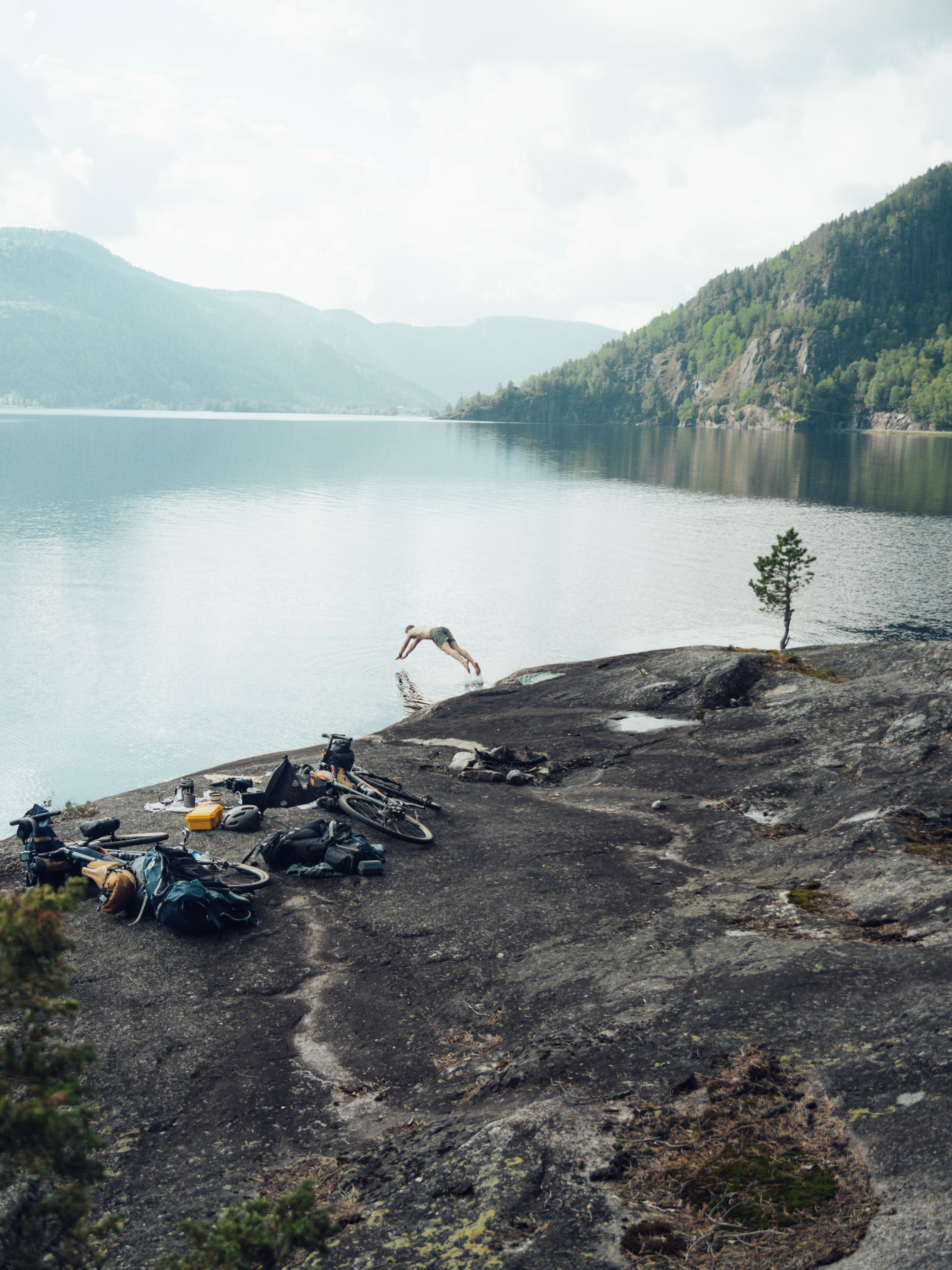 A person diving into a lake in Southern Norway