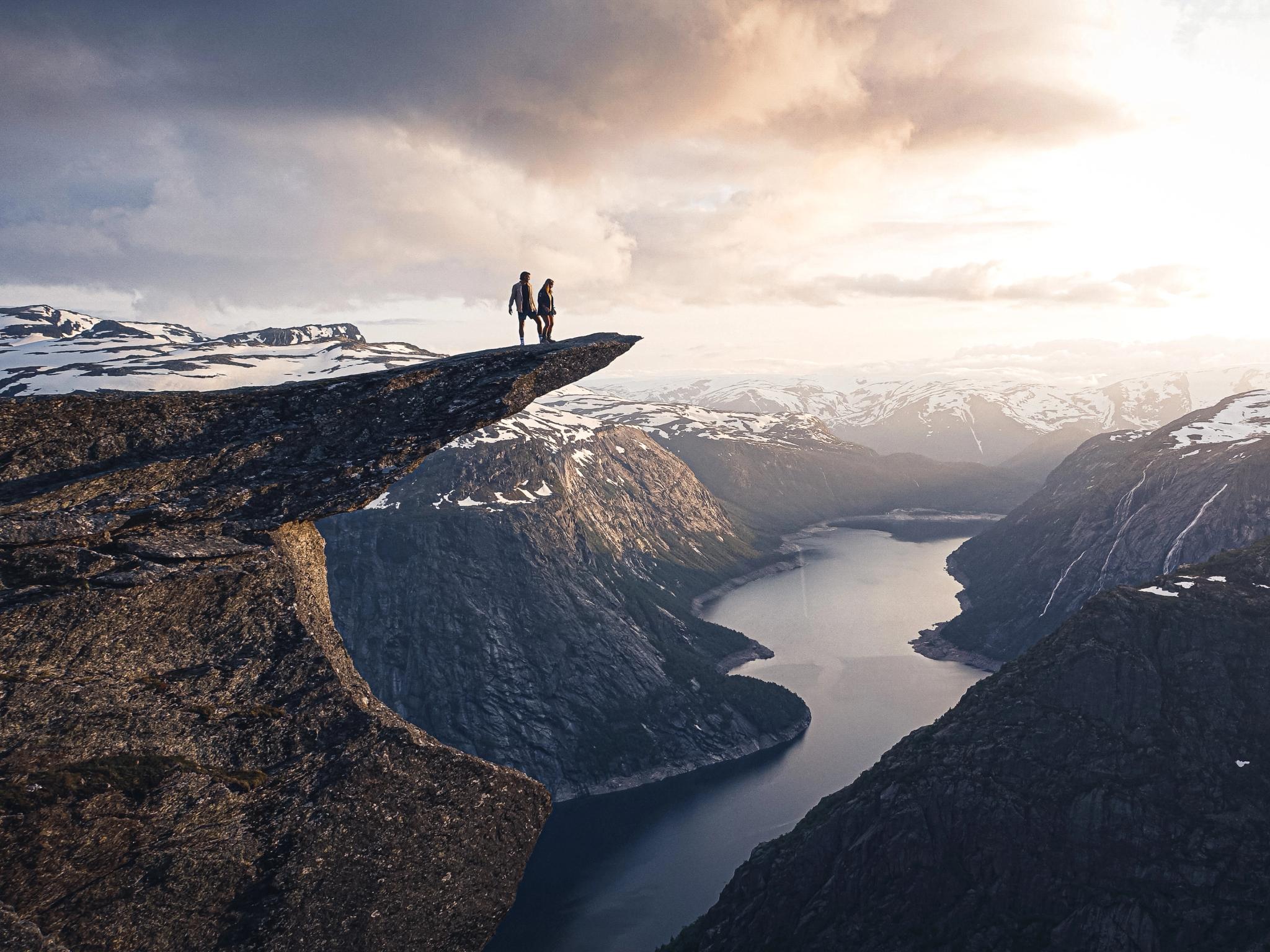 Two people on the top of Trolltunga.