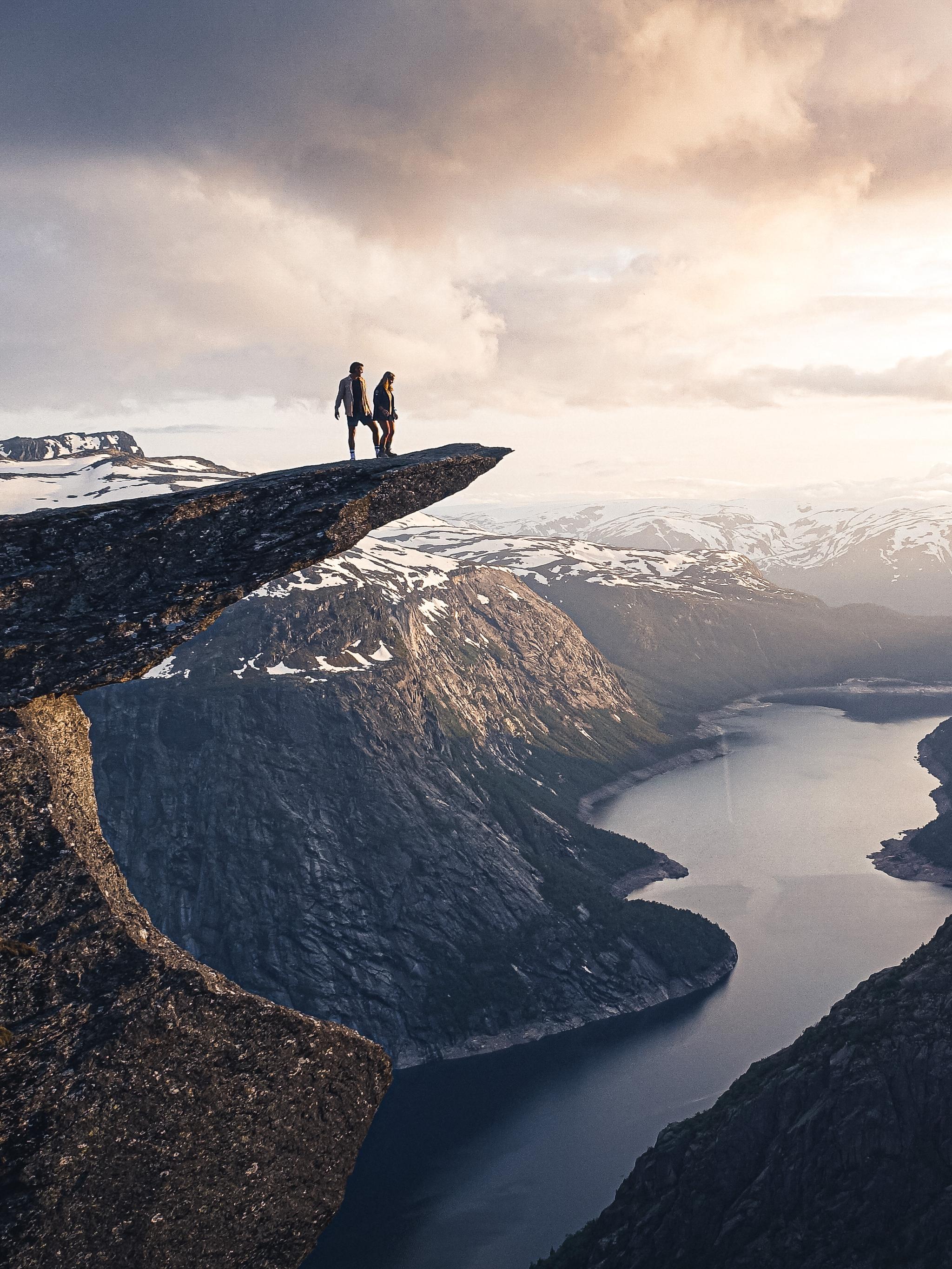 Two people on the top of Trolltunga.