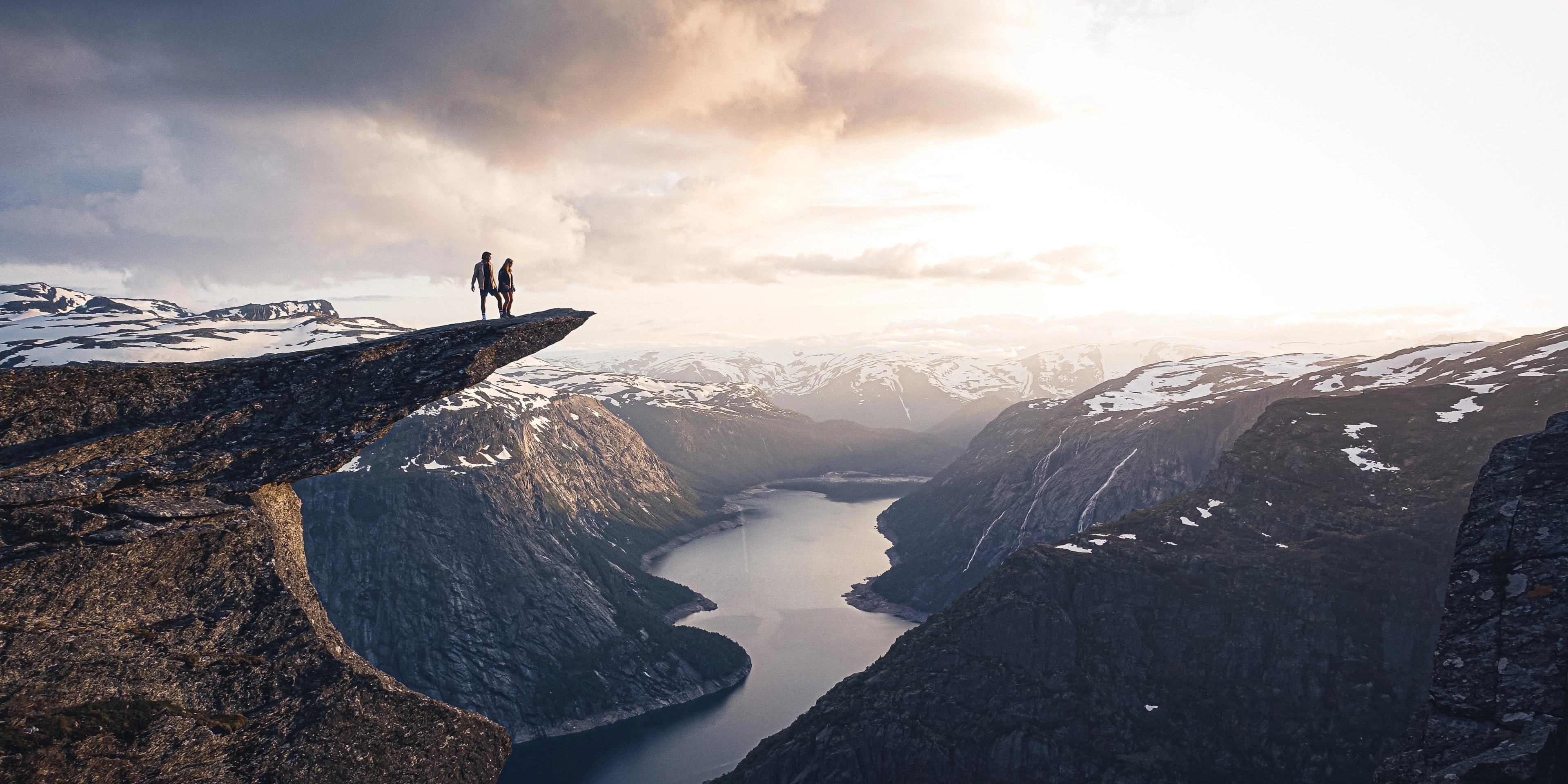 Two people on the top of Trolltunga.