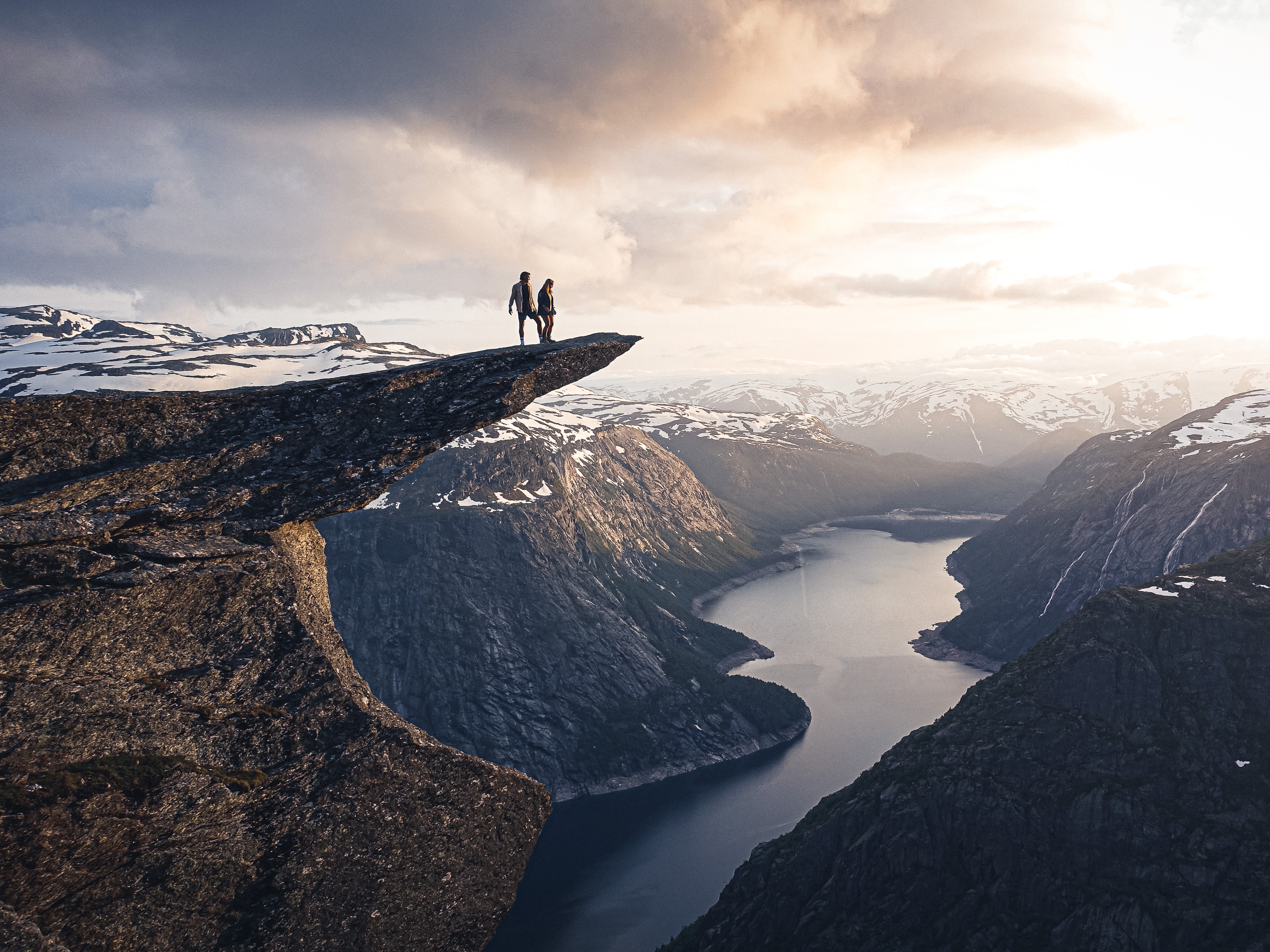 Two people on the top of Trolltunga.