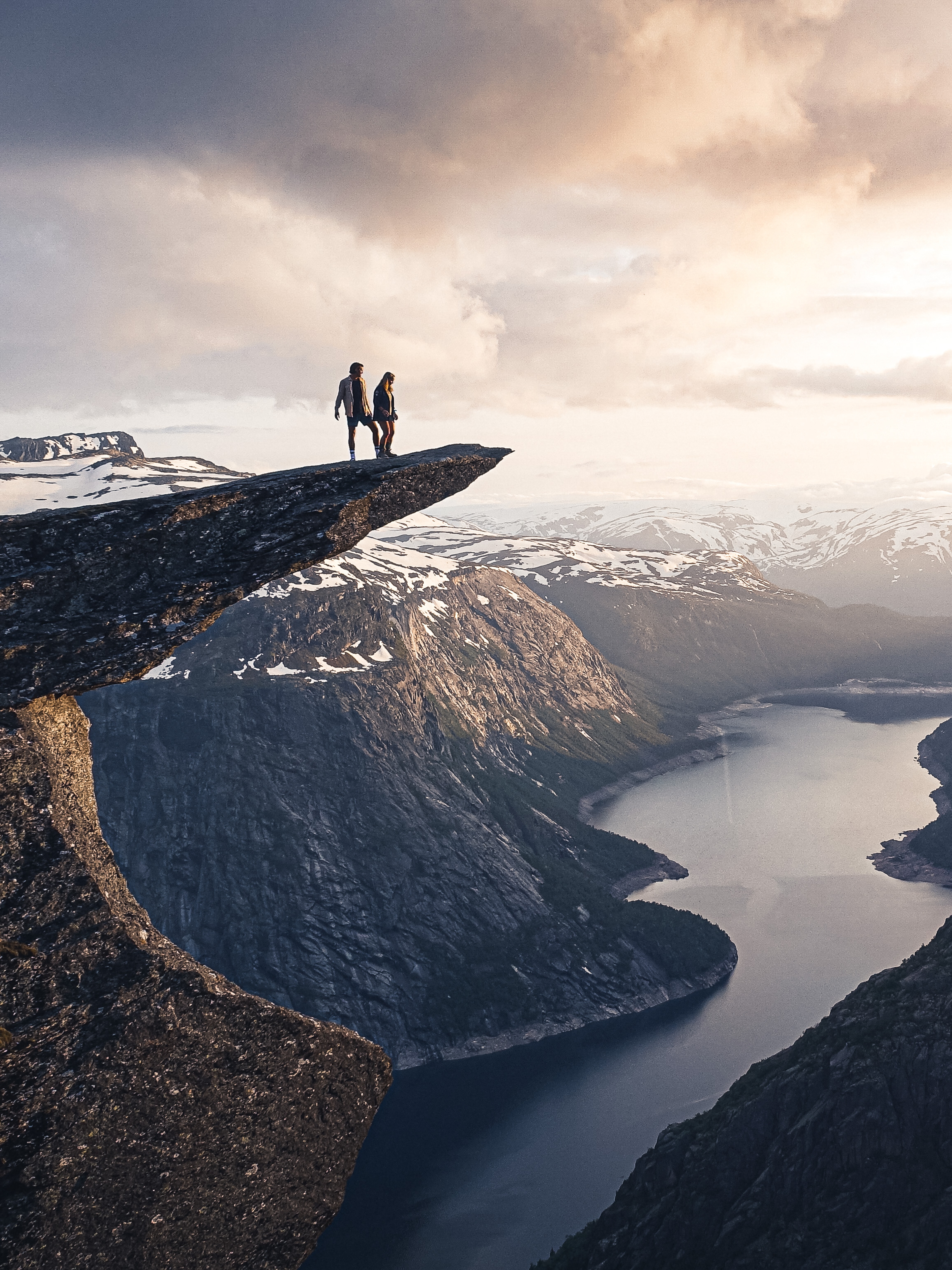 Two people on the top of Trolltunga.