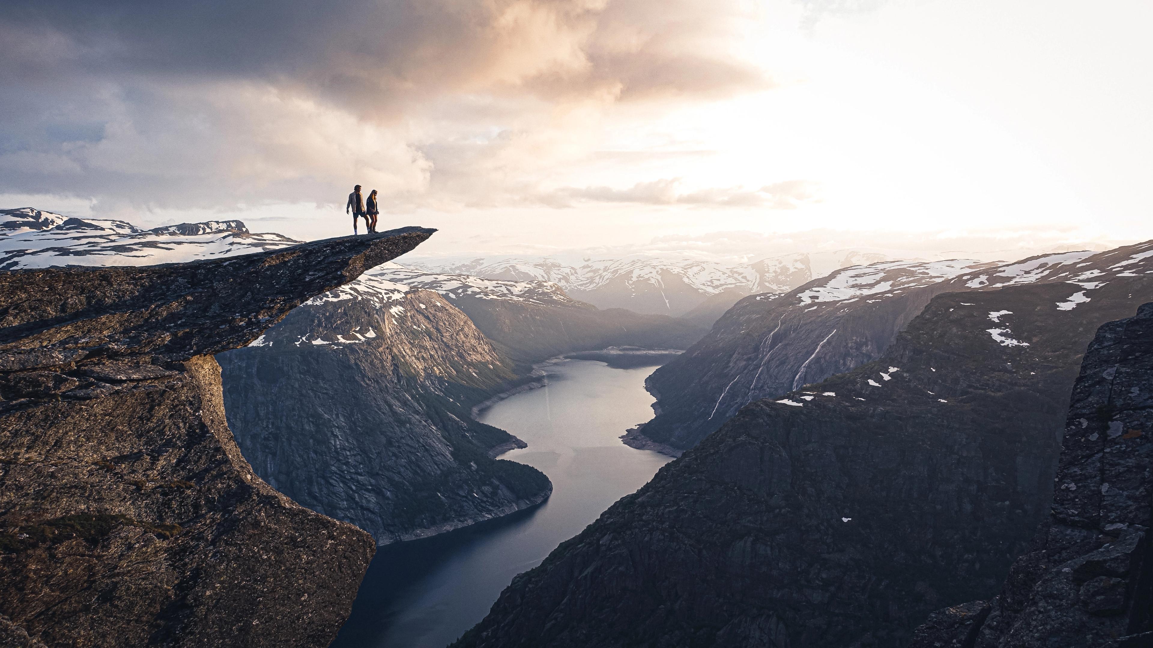 Two people on the top of Trolltunga.