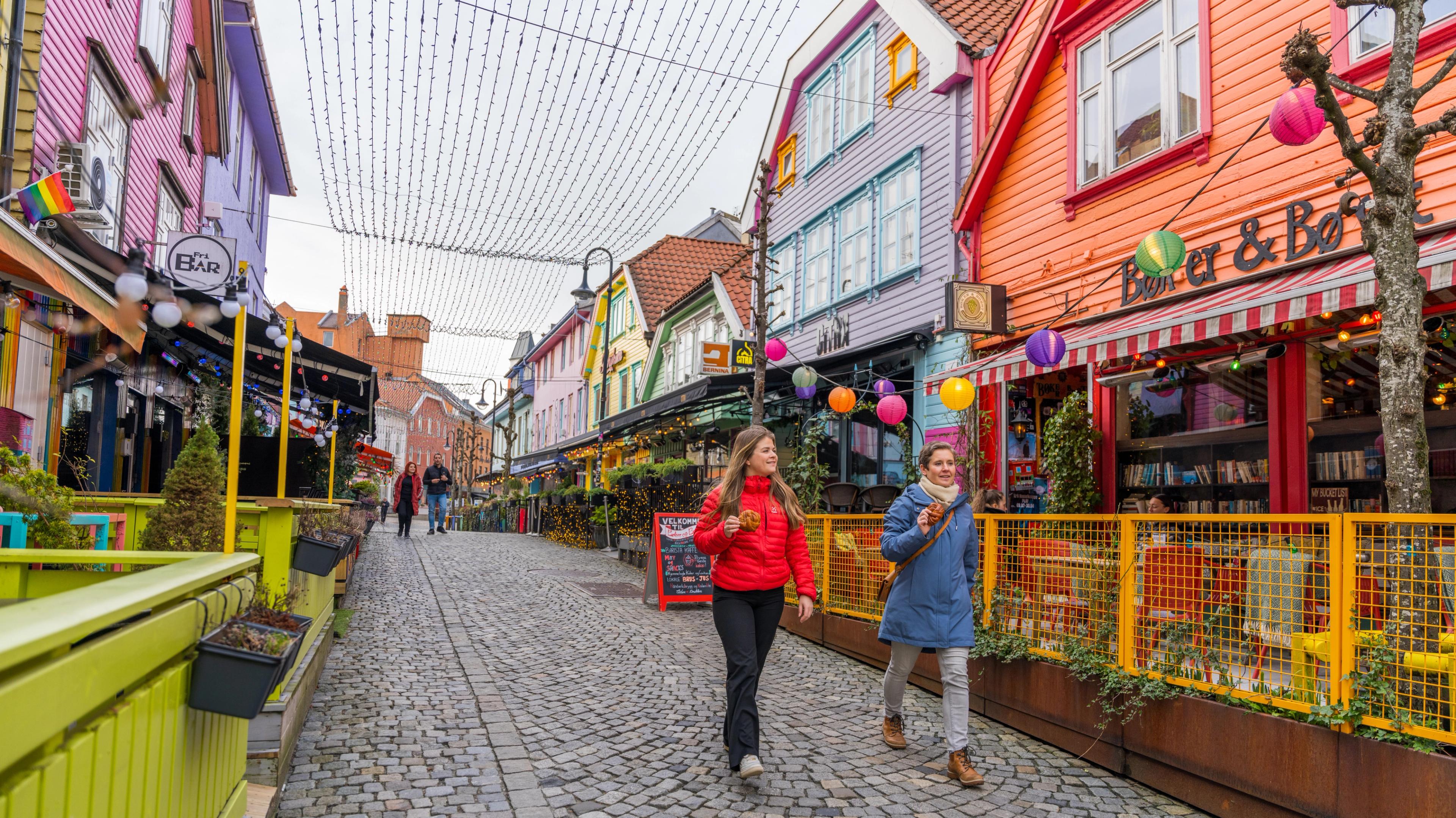 Two friends walking in Fargegaten, The colour street, in Stavanger