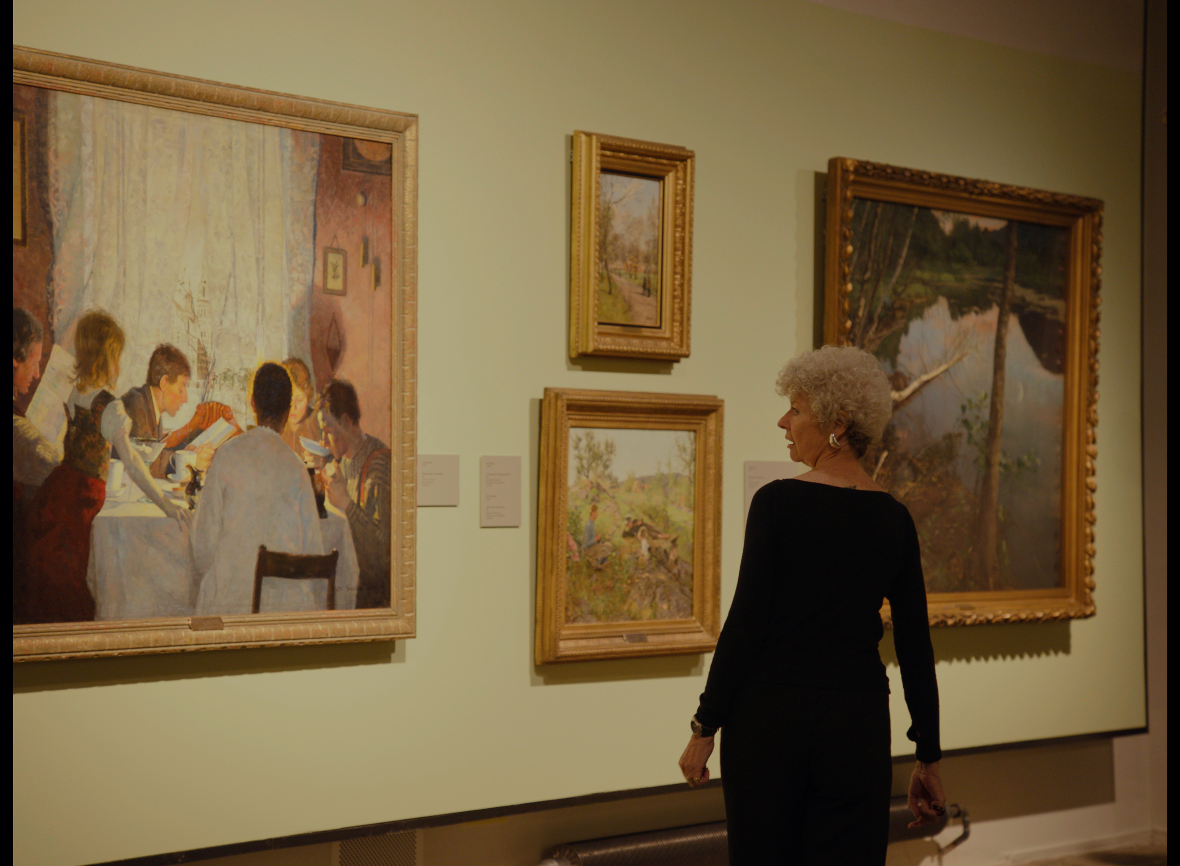 A woman looking at art at The National Museum