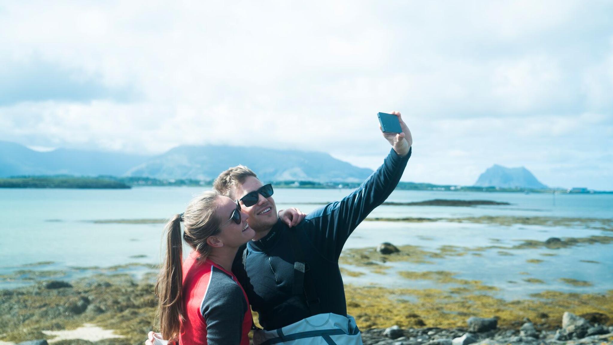Couple taking a selfie at Vega in Northern Norway