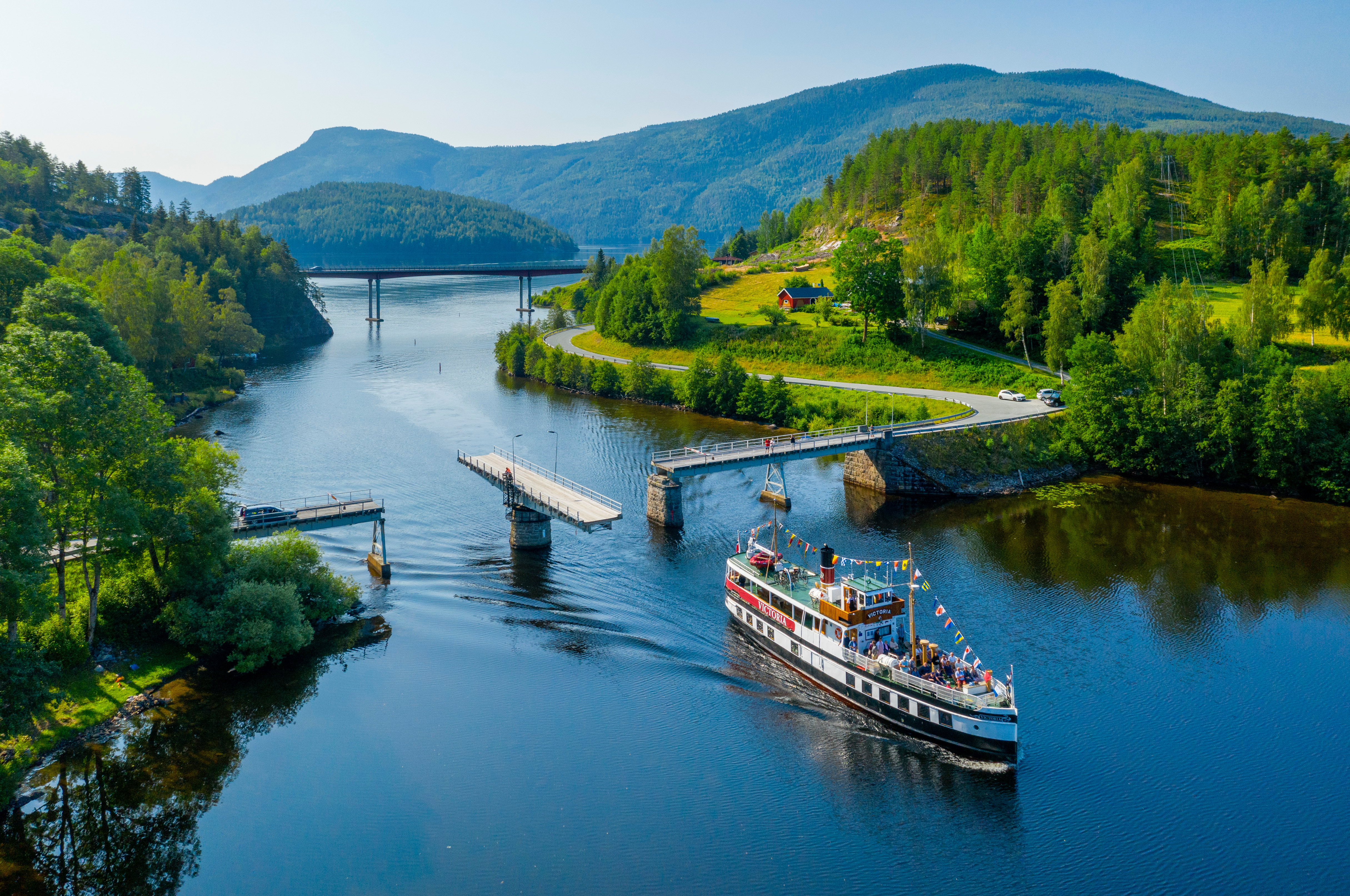 M/S Victoria passing Sundkil Bridge in Telemark, Norway