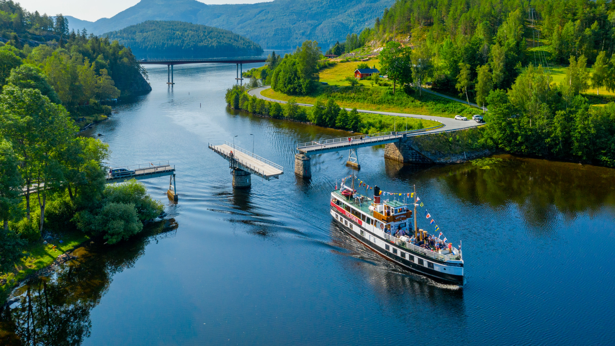 M/S Victoria passing Sundkil Bridge in Telemark, Norway
