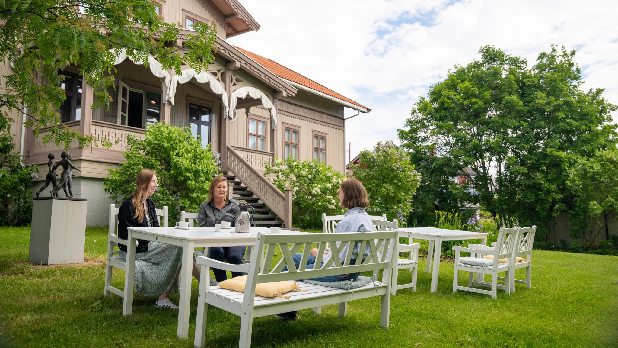 Women sat in the garden outside The Women's Museum