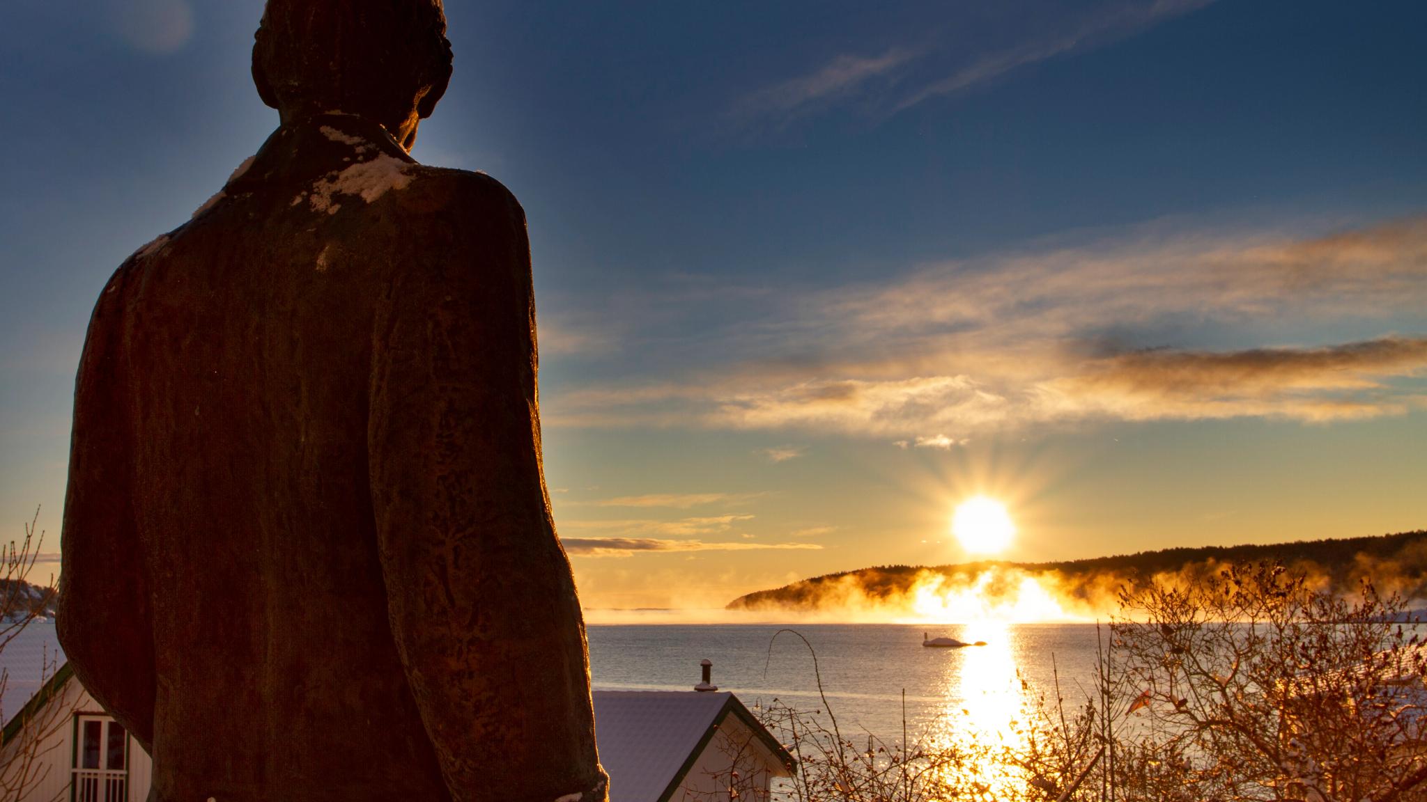 The sun rises over the Munch statue in Kragerø - Eastern Norway