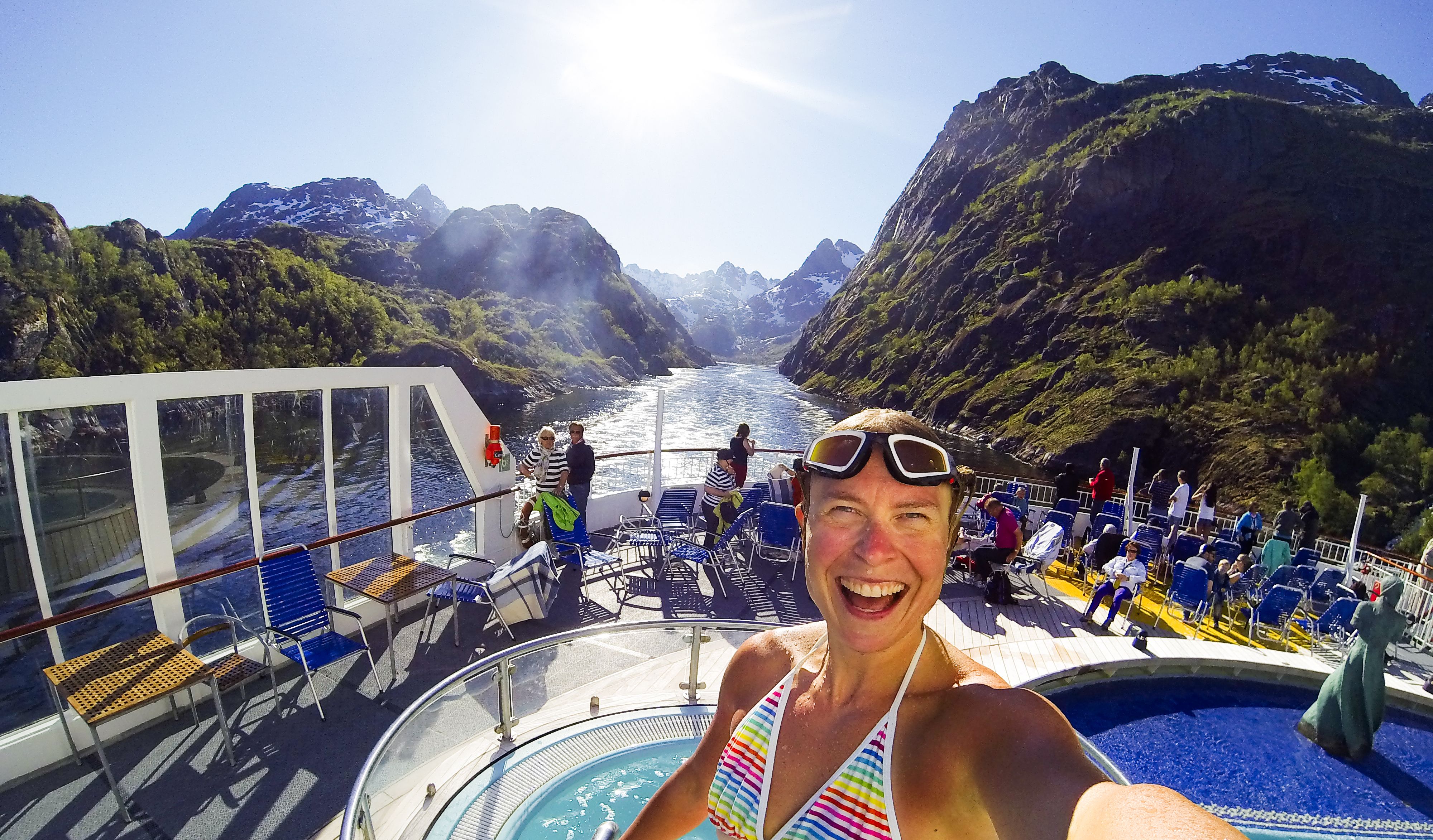 Woman taking selfie on a cruise on the Trollfjord in Vesterålen, Northern Norway