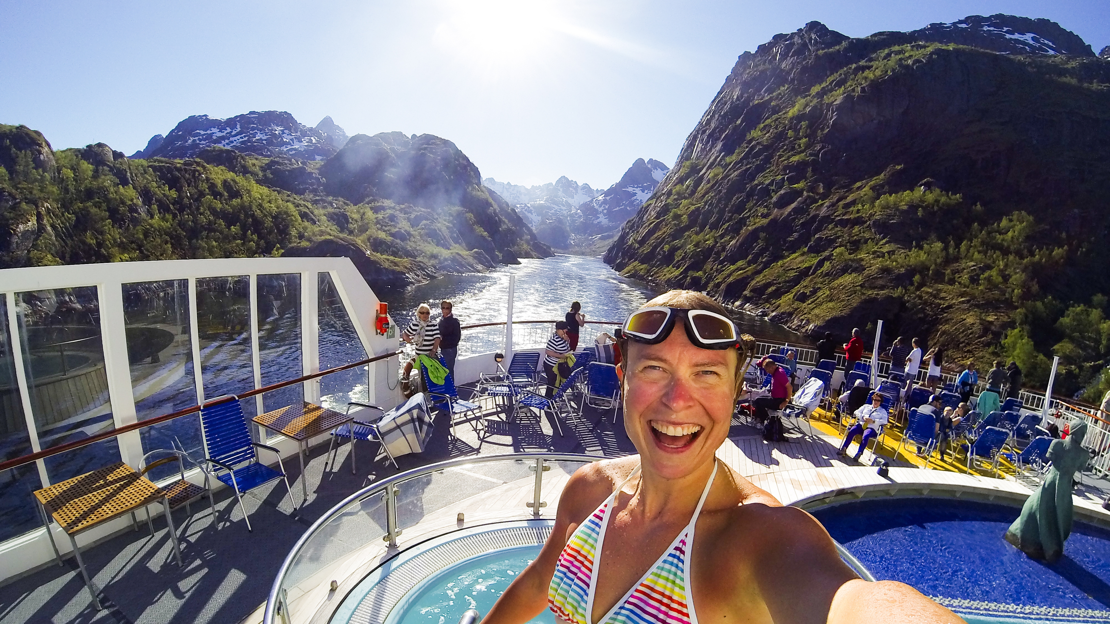 Woman taking selfie on a cruise on the Trollfjord in Vesterålen, Northern Norway