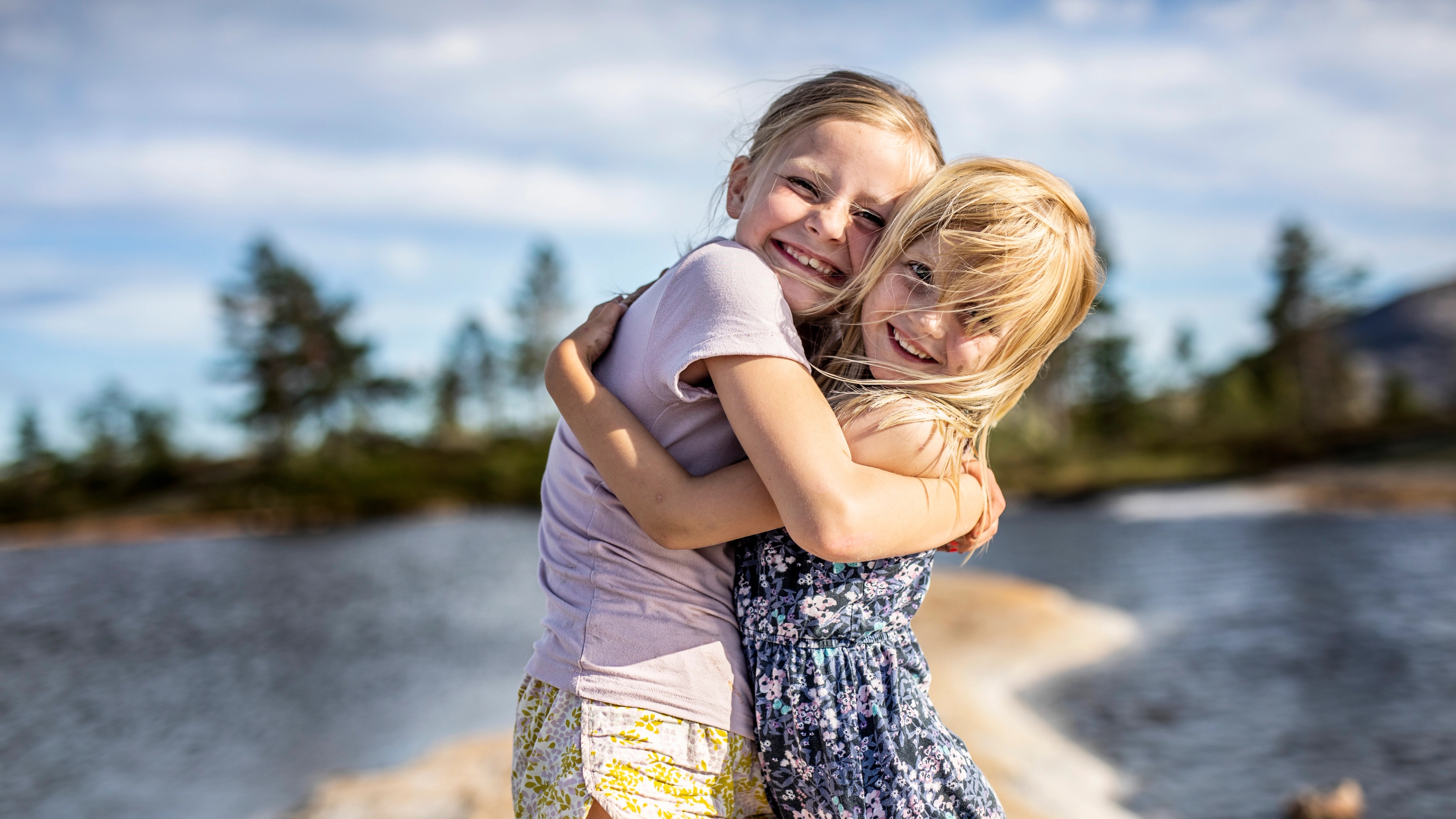 Two girls hugging each other in Vrådal, Telemark, Southern Norway