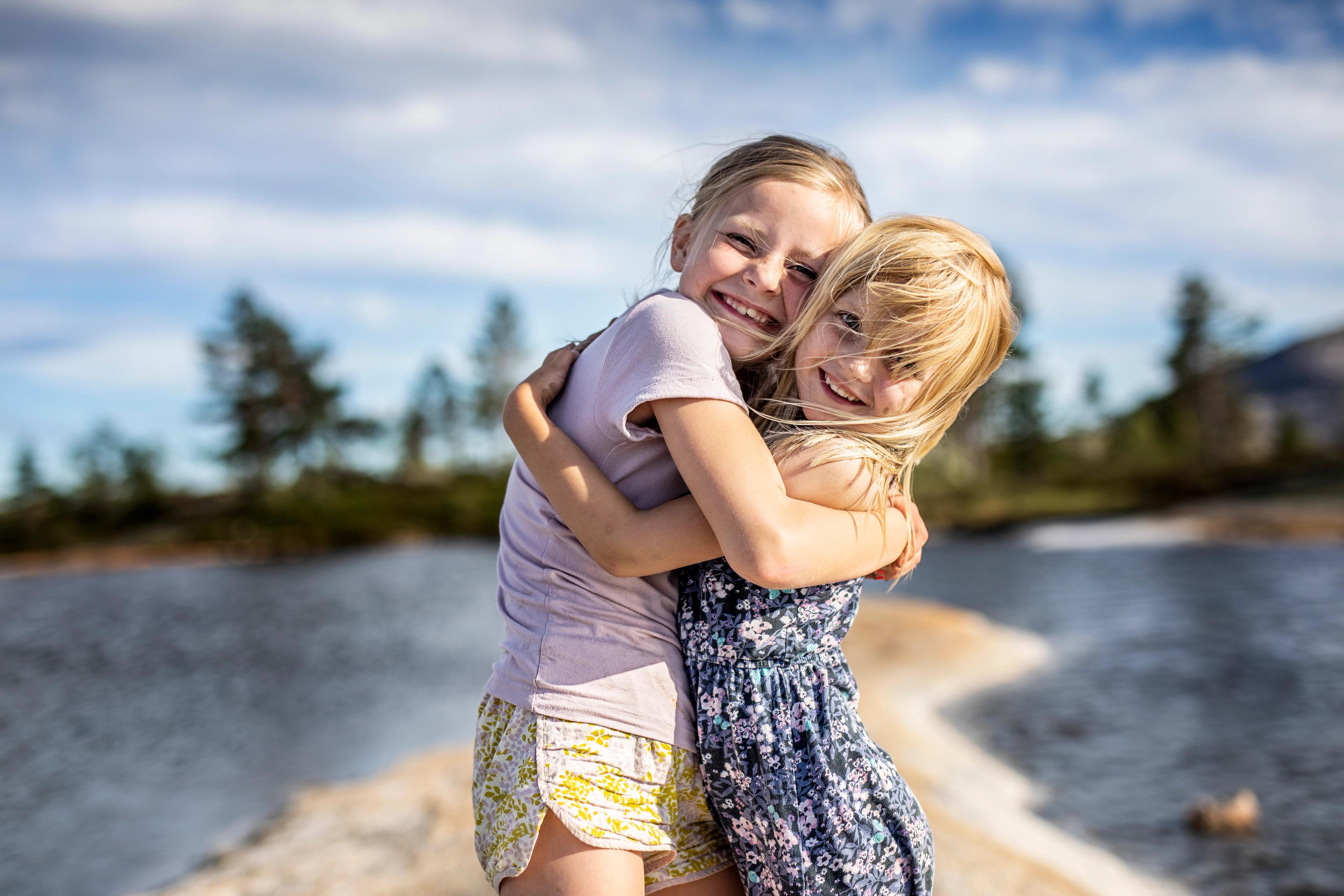 Two girls hugging each other in Vrådal, Telemark, Southern Norway