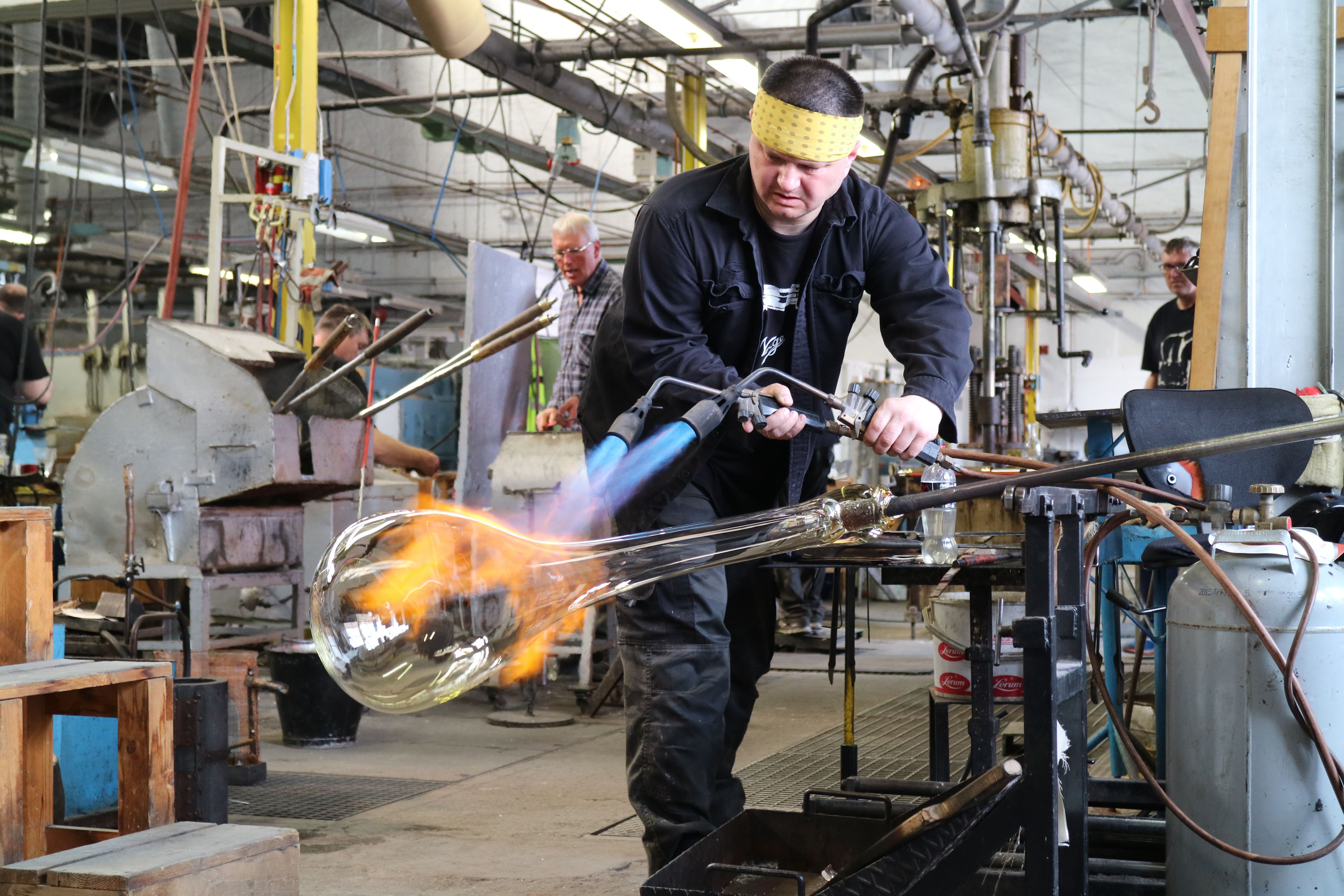 A worker making a piece of glaswork at Hadeland, Eastern Norway Glassverk