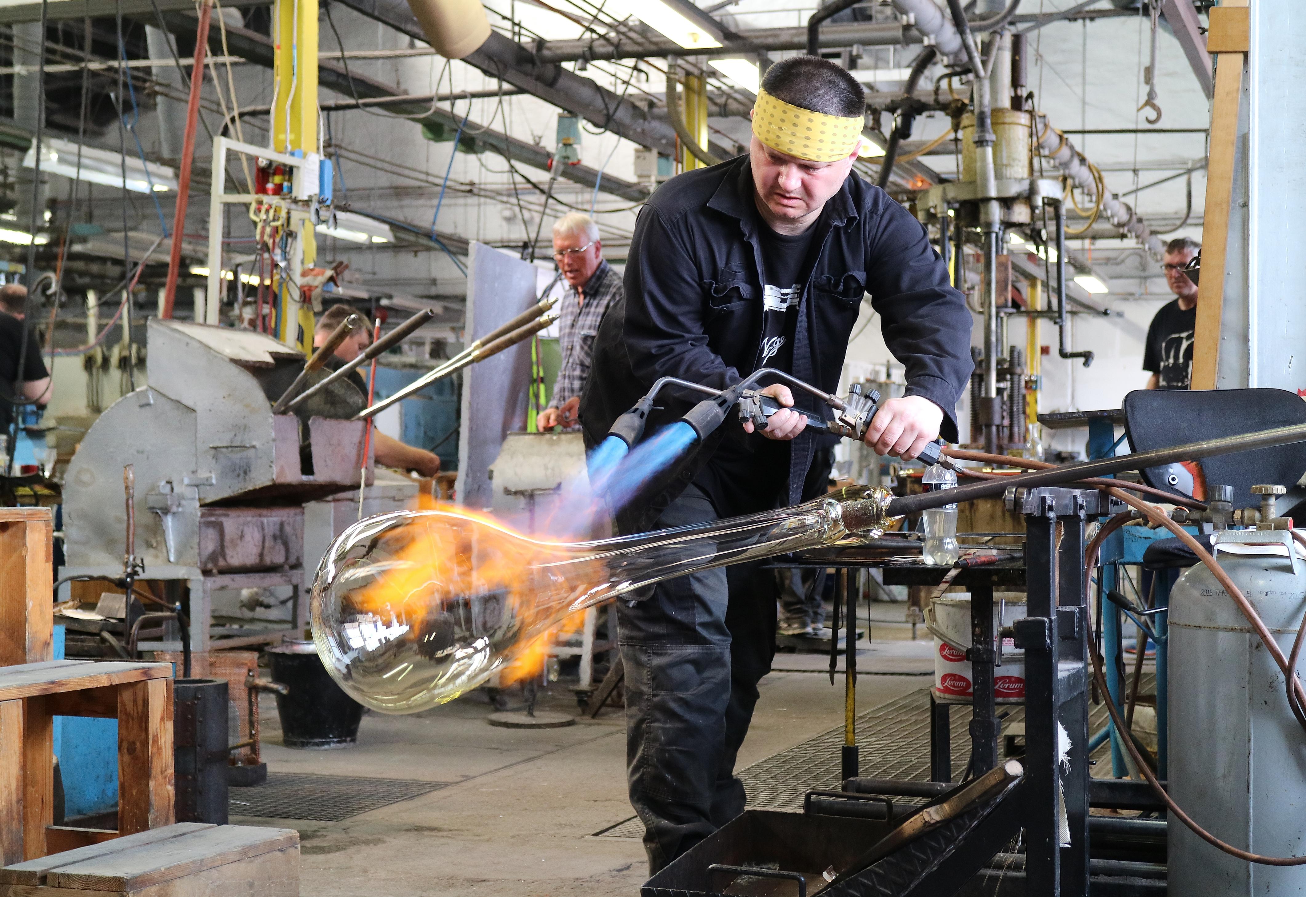 A worker making a piece of glaswork at Hadeland, Eastern Norway Glassverk