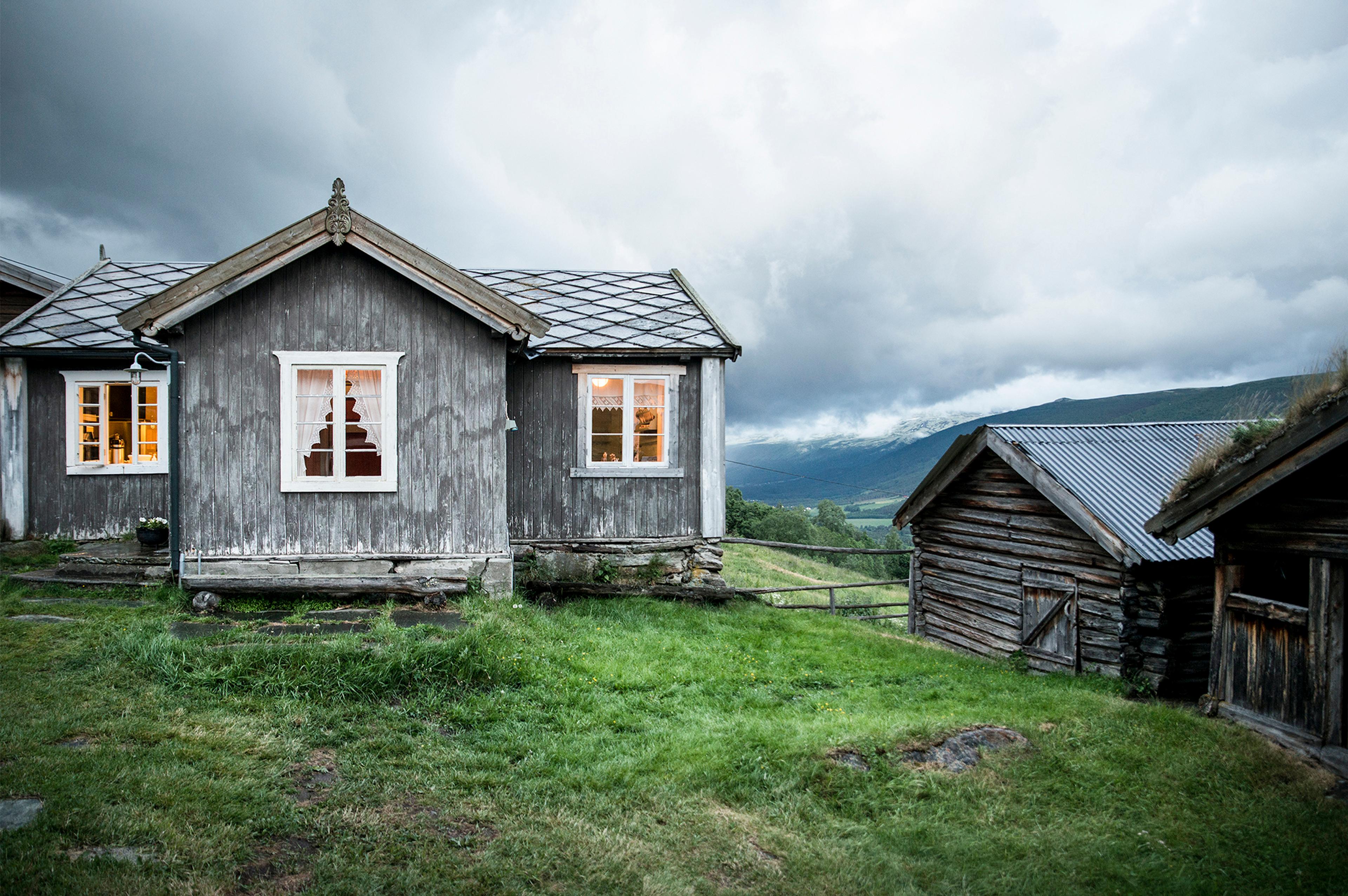 The grey houses of the farm Budsjord in the Gudbrandsdalen valley, Norway