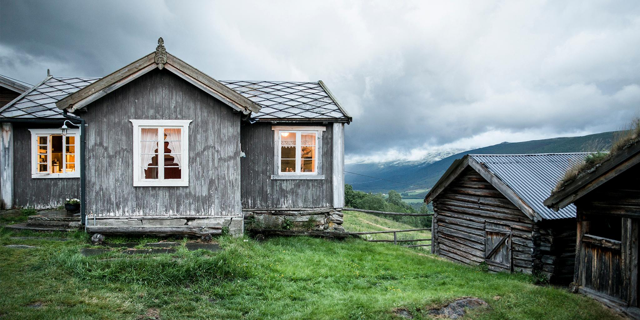 The grey houses of the farm Budsjord in the Gudbrandsdalen valley, Norway