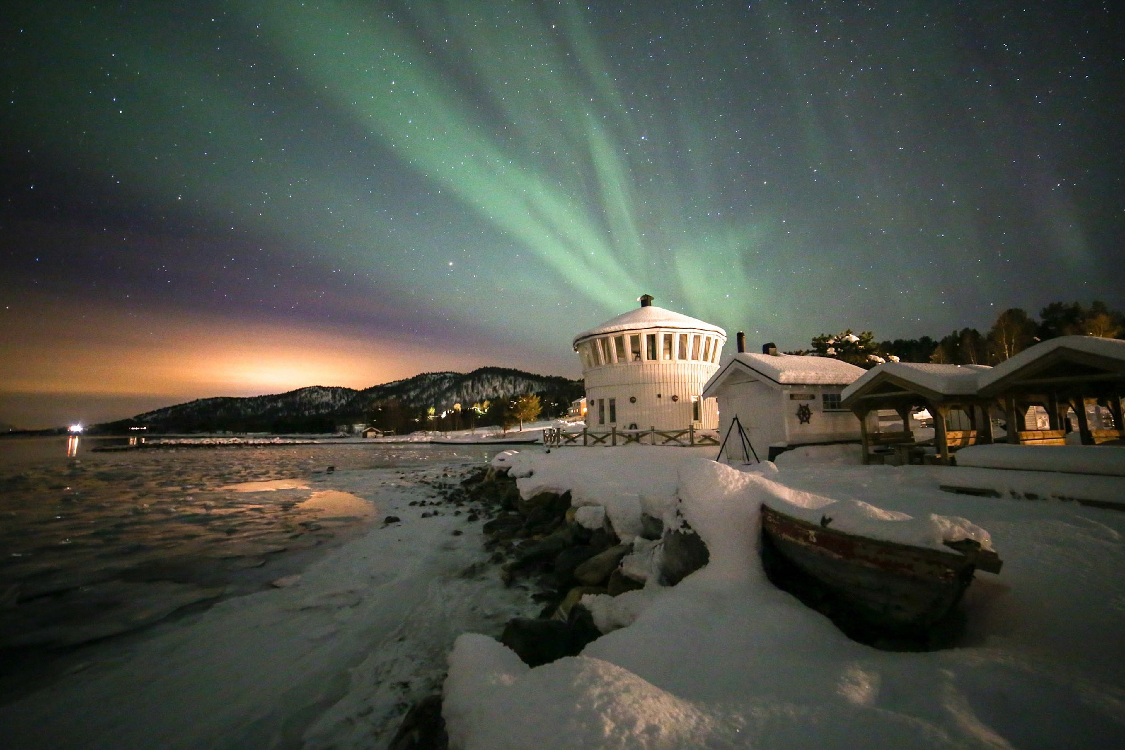 Northern lights over The Lighthouse in Senja