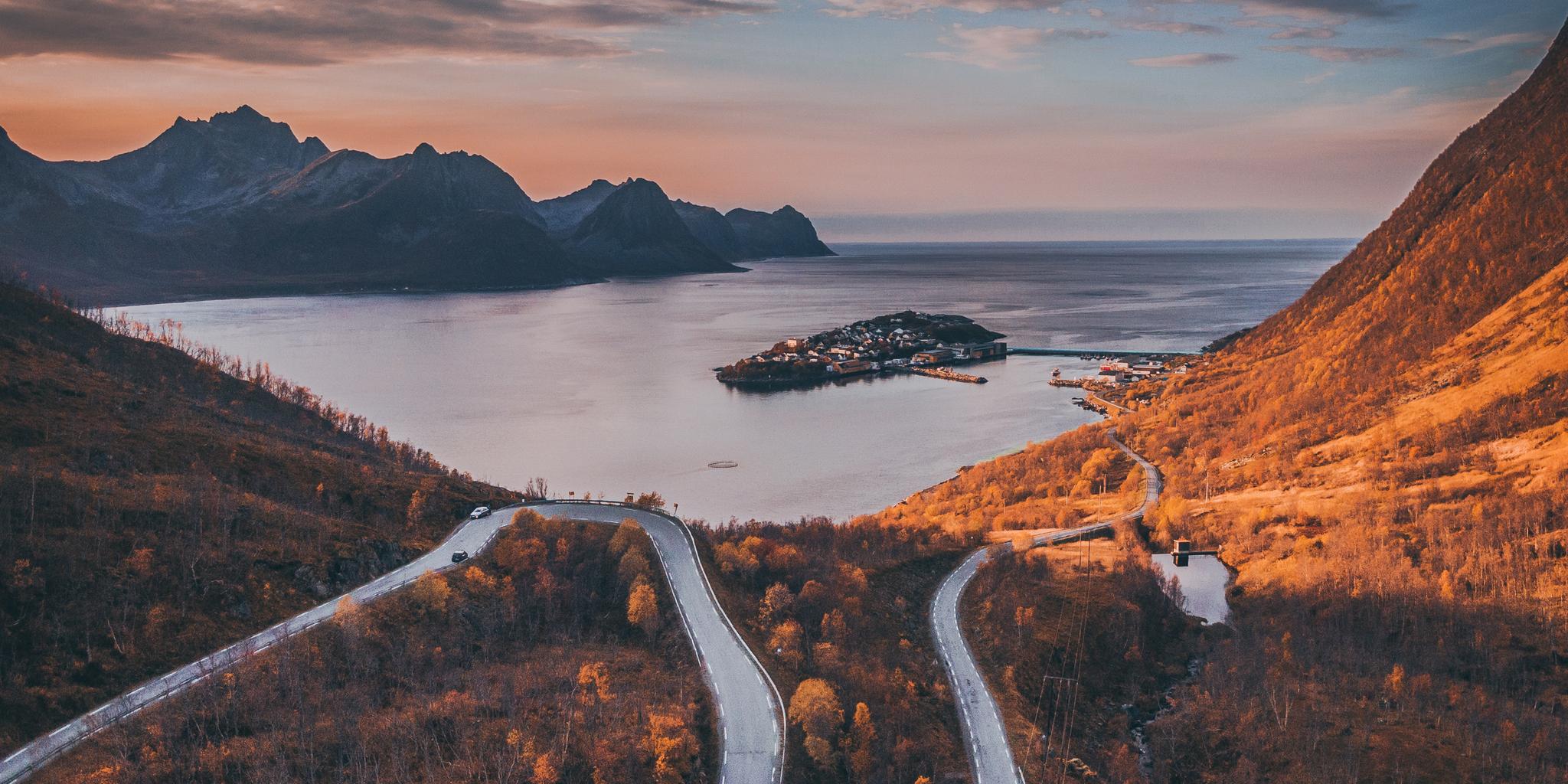 Tiny village of Husøy and winding roads in Senja