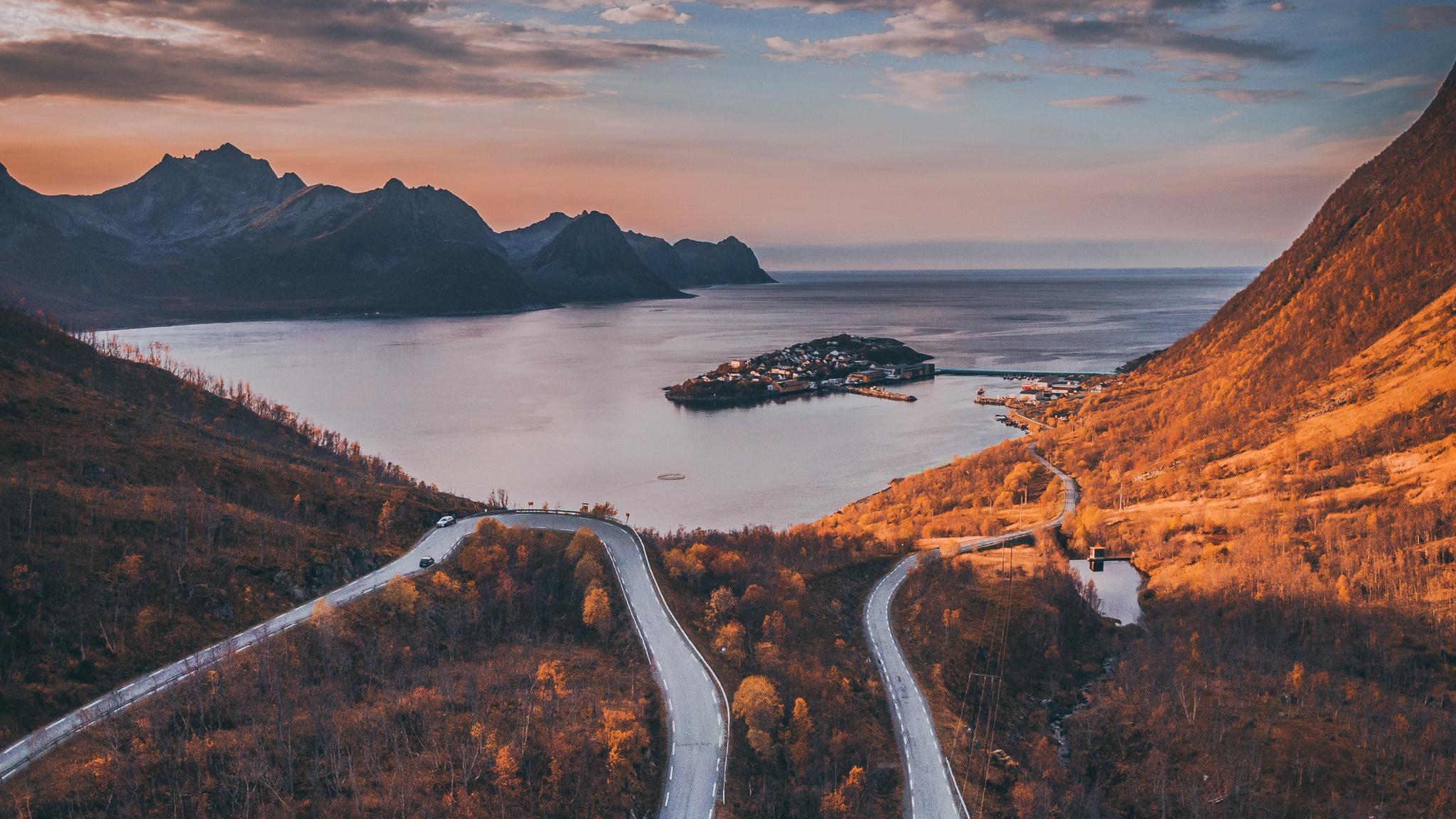 Tiny village of Husøy and winding roads in Senja