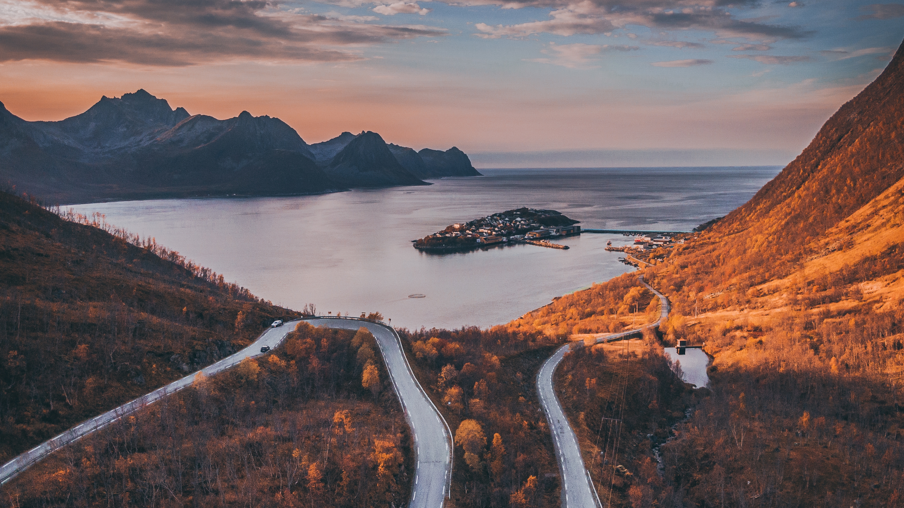 Tiny village of Husøy and winding roads in Senja