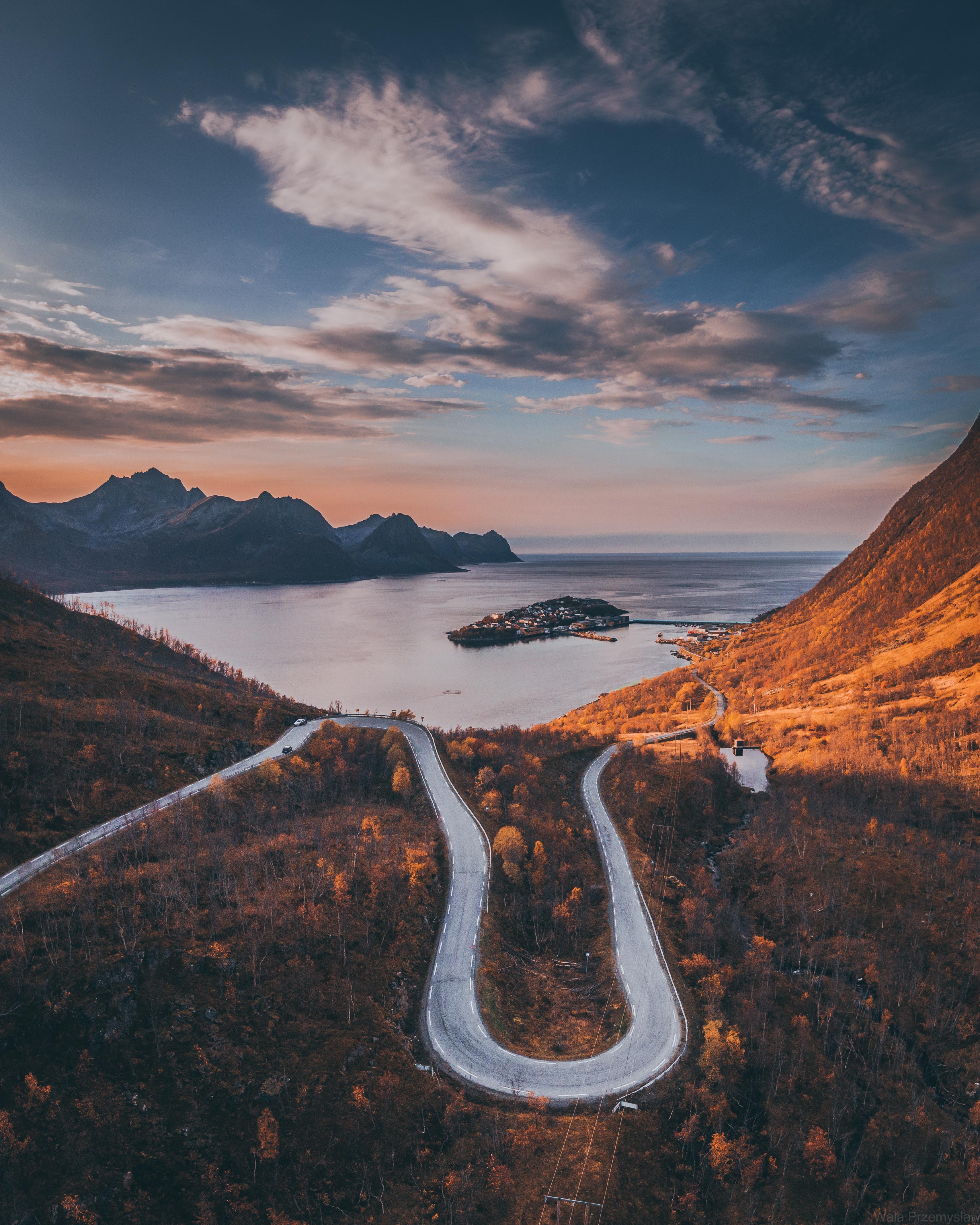 Tiny village of Husøy and winding roads in Senja