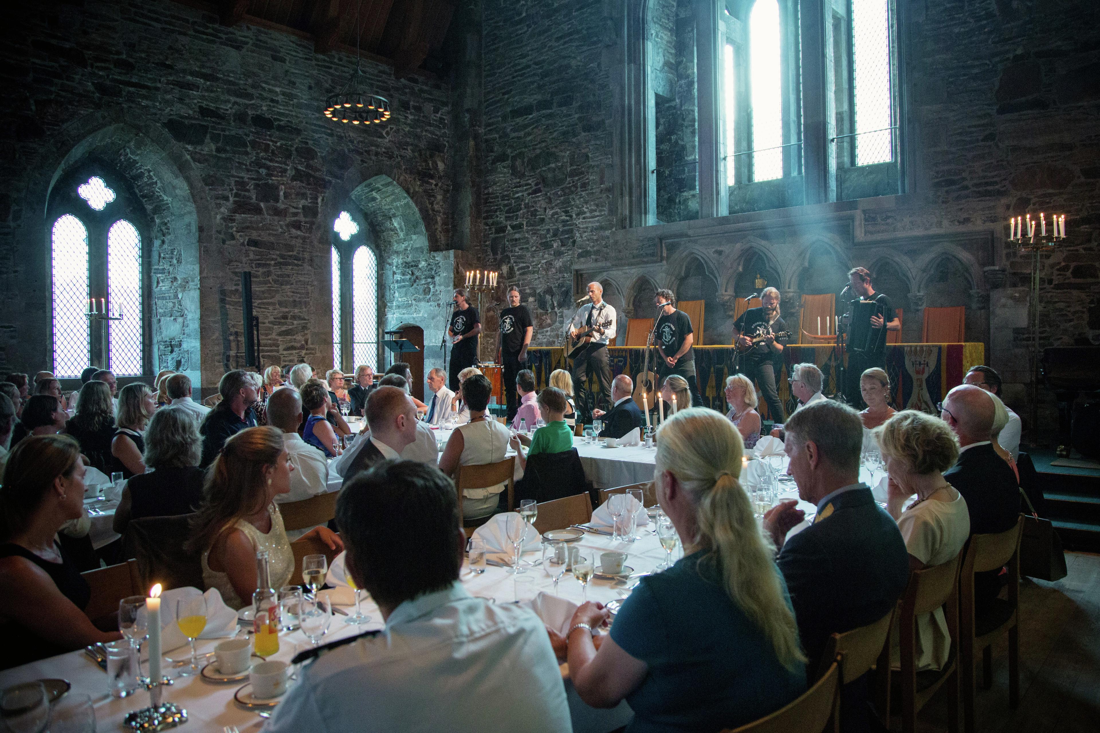 Storm Weather Shanty Choir perform during the Captains' dinner