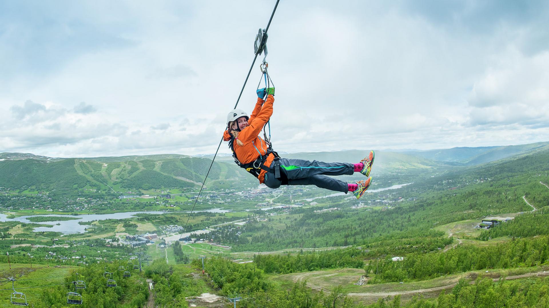 A woman zip lining in Geilo, Eastern Norway