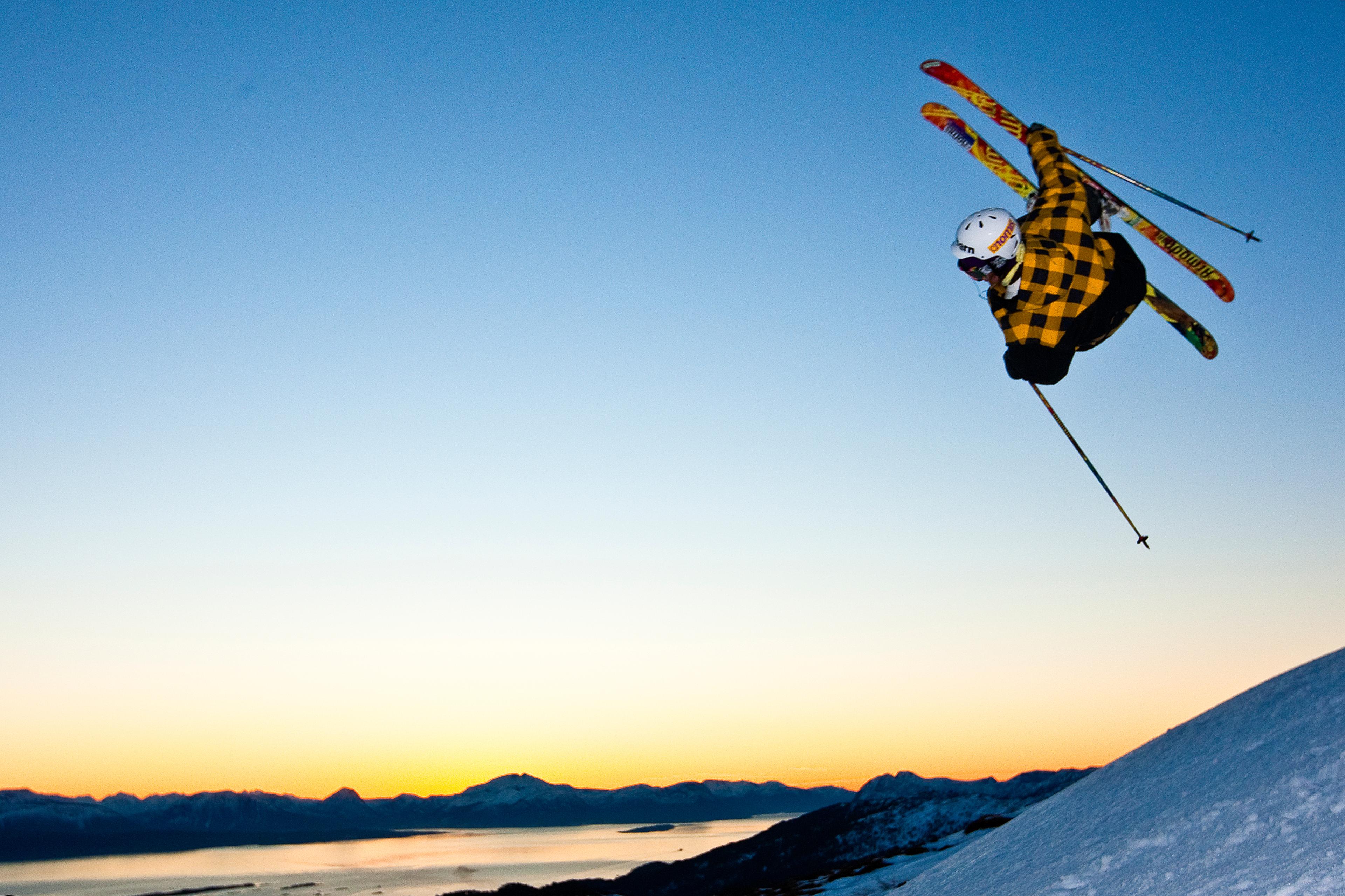 Skiers jumping in the slopes of Tusten Skiheiser, Molde