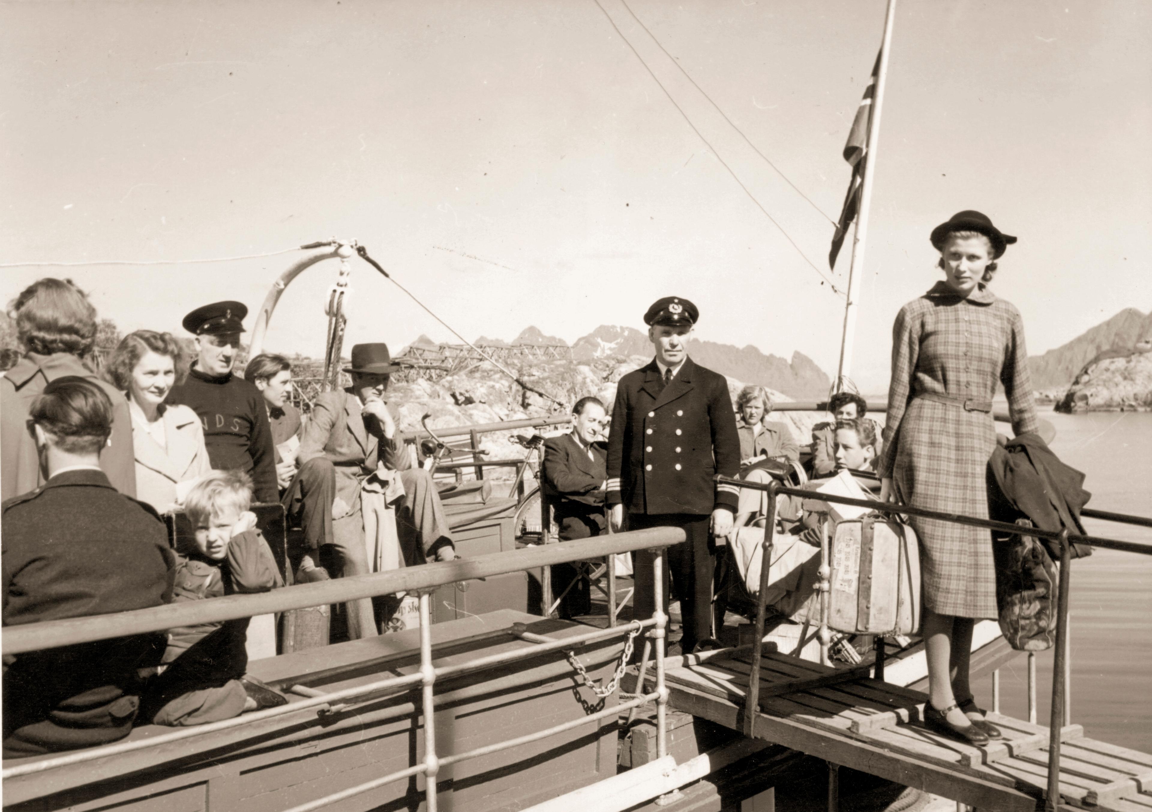 A black and white photo of a woman embarking from a Hurtigruten ship in Norway