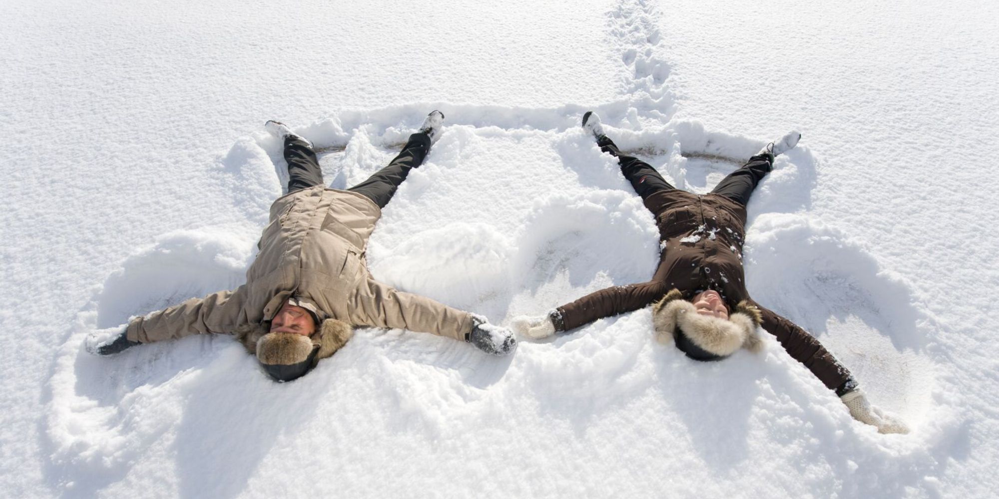 Two people playing in the snow in Finnmark