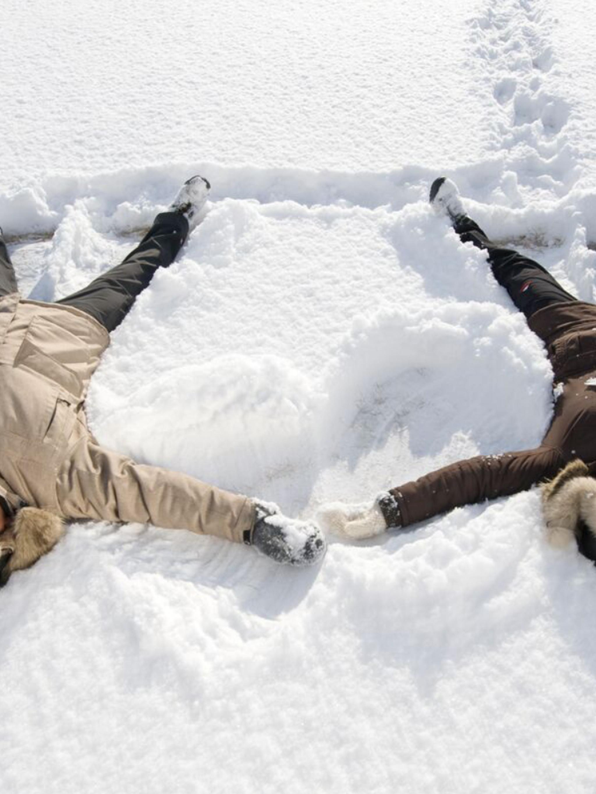 Two people playing in the snow in Finnmark