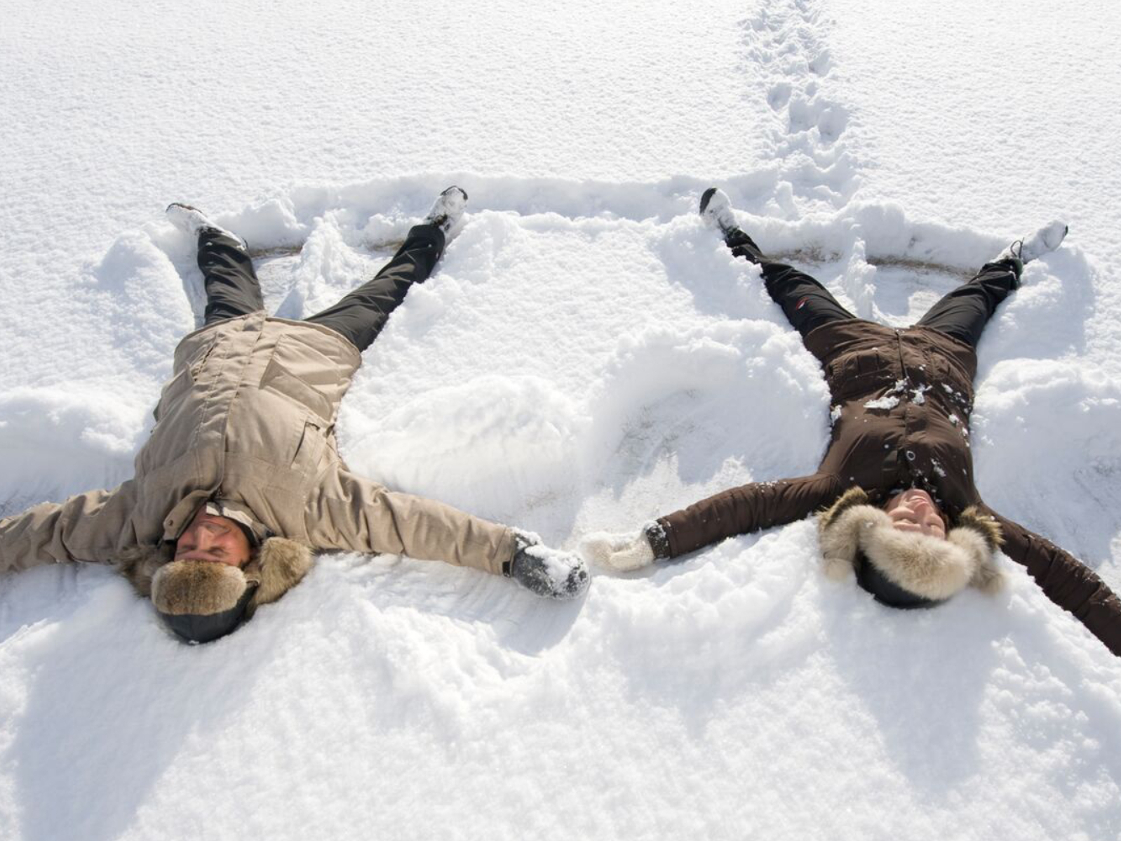 Two people playing in the snow in Finnmark